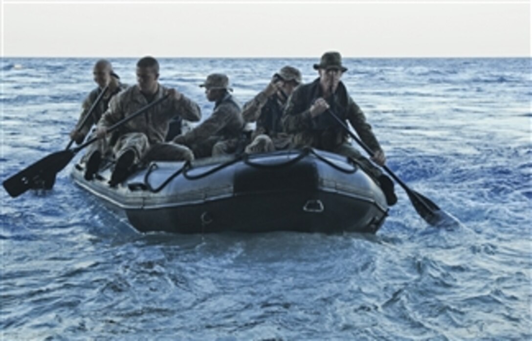 U.S. Marines assigned to the 31st Marine Expeditionary Unit launch a combat rubber raiding craft from the stern gate of the forward-deployed amphibious assault ship USS Essex (LHD 2) during a training mission in the South China Sea on March 3, 2010.  The Essex is part of the forward-deployed Essex Amphibious Ready Group and is conducting spring patrol throughout the Western Pacific region.  