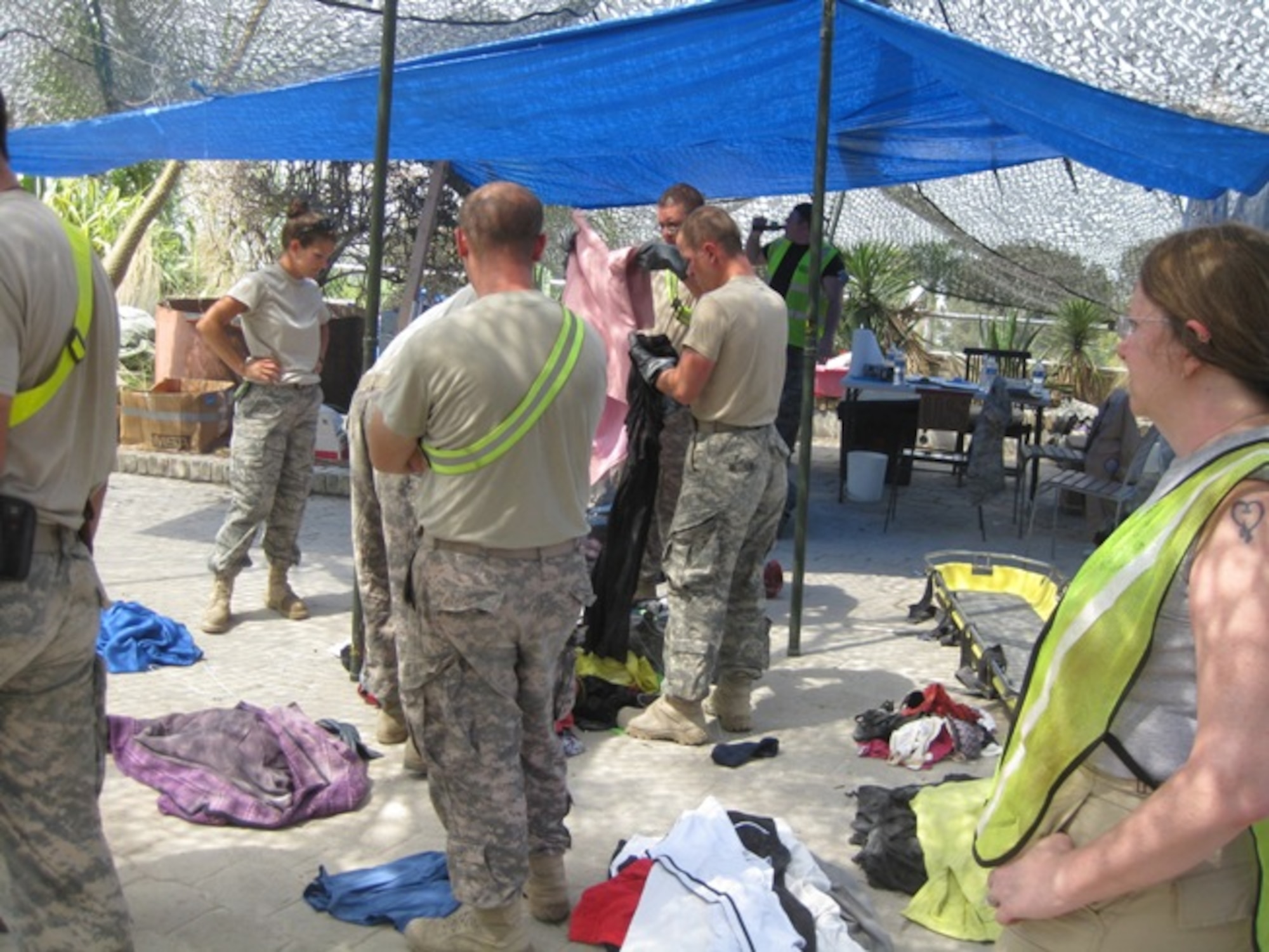 Connecticut’s own Master Sgt. Melissa Letizio, noncommissioned officer in charge of billeting, 24th Air Expeditionary Group, helps other search and recovery personnel sort personal affects found at the Hotel Montana site in Port-au-Prince, Haiti. (Photo courtesy of TSgt. Bambi Putinas)