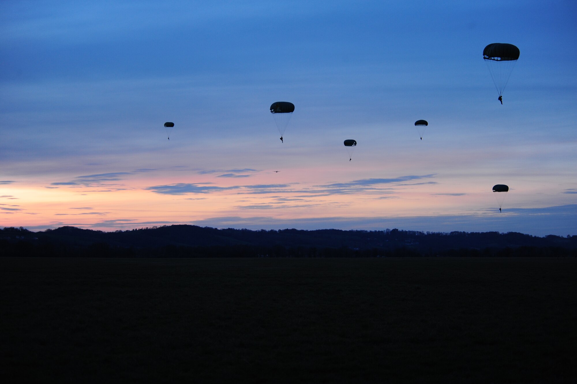 French and U.S. paratroopers land at the drop zone of a combined nation jump on March 2, 2010. The French used U.S. used U.S. equipment durring this jump.  Members of the 435th Contingency Response Group and the 5th Quartermaster Company joined with their French military counterparts for a week of training at the École des troupes aéroportées (ETAP), or School of Airborne Troops, a military school dedicated to training the military paratroopers   of the French army, located in the town of Pau, in the département  of Pyrénées-Atlantiques , France.  The ETAP is responsible for training paratroopers, and for international cooperation and promotion of paratroop culture. (U.S. Air Force Photo by Staff Sgt. Jocelyn Rich)