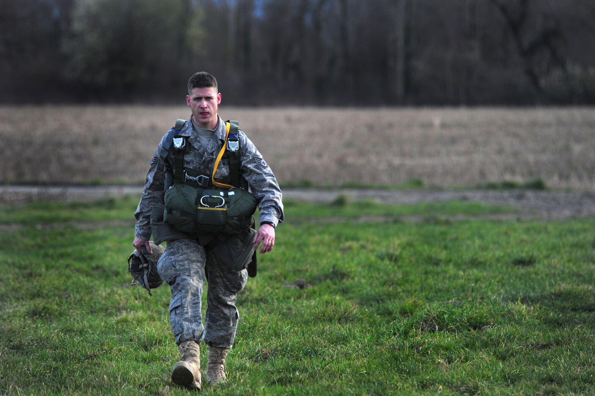 U.S. Air Force Staff Sgt. Ronald Booth makes his way to the drop zone of a multinational jump to perform communication equipment maintenance. Members of the 435th Contingency Response Group and the 5th Quartermaster Company joined with their French military counterparts for a week of training at the École des troupes aéroportées (ETAP), or School of Airborne Troops, a military school dedicated to training the military paratroopers   of the French army, located in the town of Pau, in the département  of Pyrénées-Atlantiques , France.  The ETAP is responsible for training paratroopers, and for international cooperation and promotion of paratroop culture. (U.S. Air Force Photo by Staff Sgt. Jocelyn Rich)