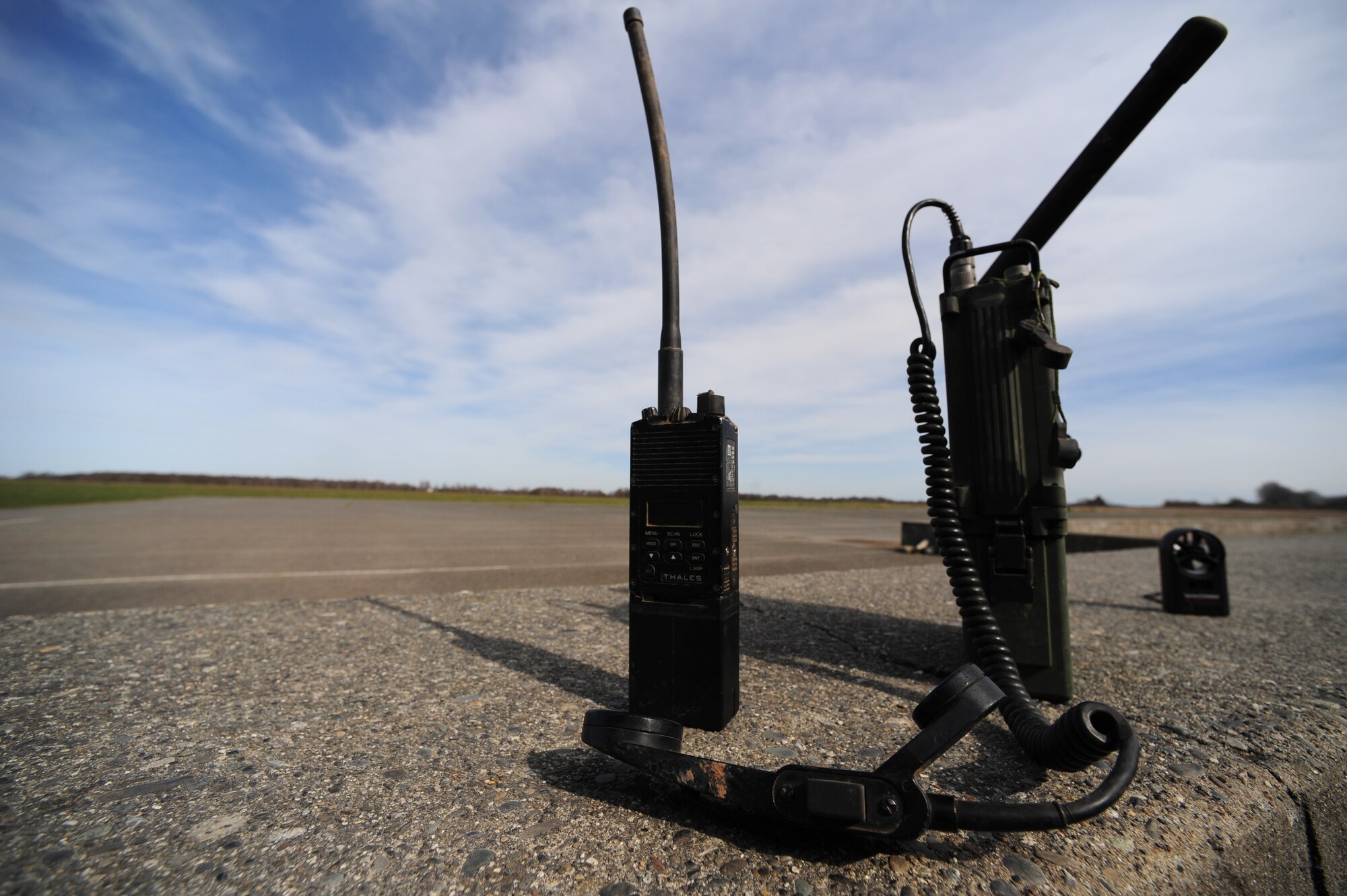 U.S. military communications equipment stands at the ready for use at a drop zone of a multi nation jump with U.S. and French paratroopers.  The equipment is used from the ground to establish contact with the aircraft during the jump to update on weather and drop zone conditions. Members of the 435th Contingency Response Group and the 5th Quartermaster Company joined with their French military counterparts for a week of training at the École des troupes aéroportées (ETAP), or School of Airborne Troops, a military school dedicated to training the military paratroopers   of the French army, located in the town of Pau, in the département  of Pyrénées-Atlantiques , France.  The ETAP is responsible for training paratroopers, and for international cooperation and promotion of paratroop culture. (U.S. Air Force Photo by Staff Sgt. Jocelyn Rich)