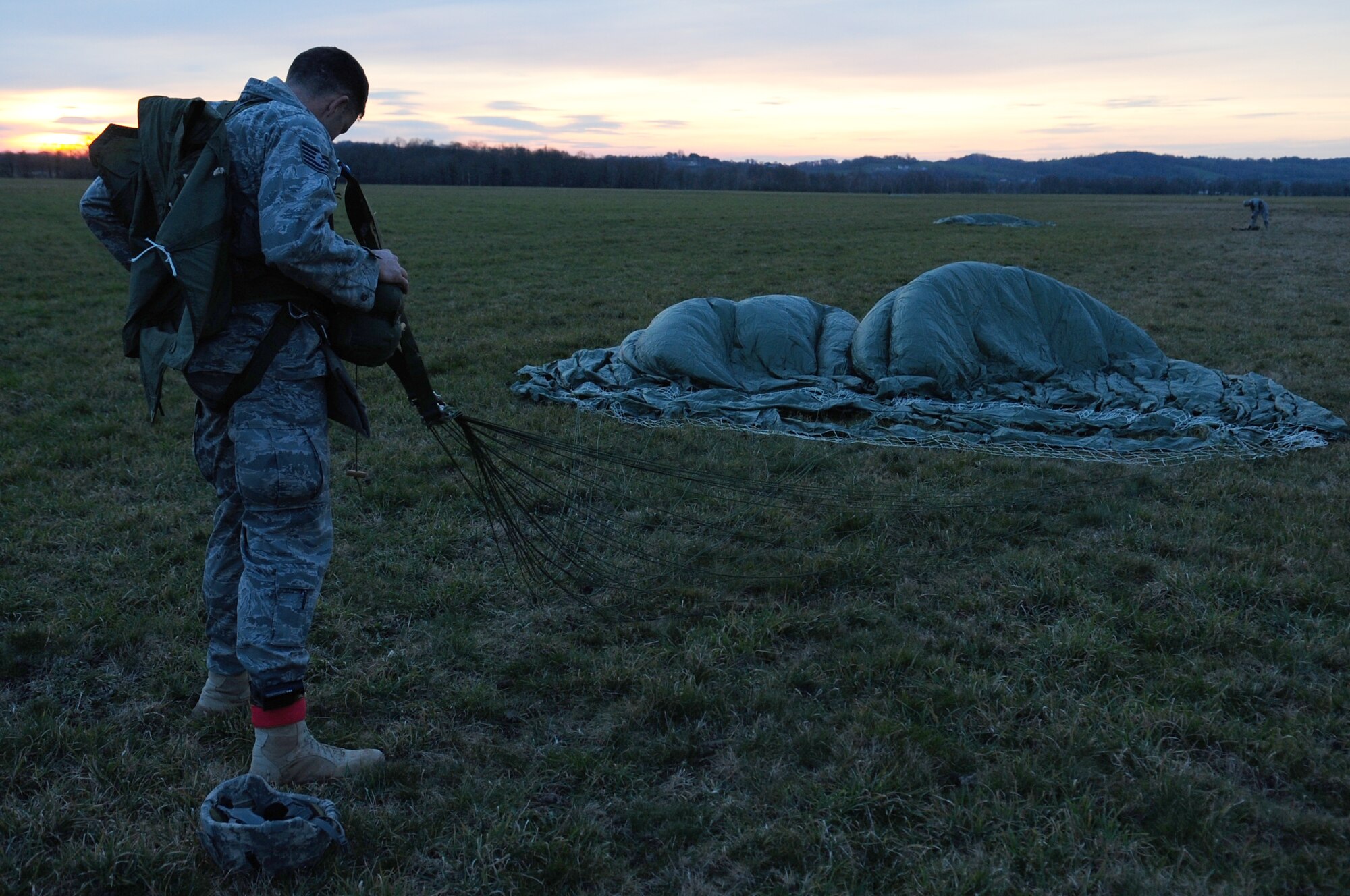 U.S. Air Force Tech . Sgt. Jason Shaffer, removes his gear on the drop zone of a multi nation jump, March 2, 2010.  Members of the 435th Contingency Response Group and the 5th Quartermaster Company joined with their French military counterparts for a week of training at the École des troupes aéroportées (ETAP), or School of Airborne Troops, a military school dedicated to training the military paratroopers   of the French army, located in the town of Pau, in the département  of Pyrénées-Atlantiques , France.  The ETAP is responsible for training paratroopers, and for international cooperation and promotion of paratroop culture. (U.S. Air Force Photo by Staff Sgt. Jocelyn Rich)