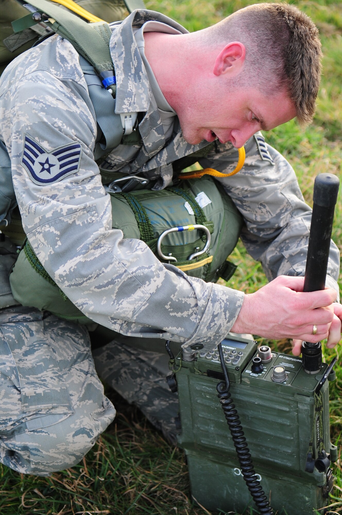 U.S. Air Force Staff Sgt. Ronald Booth repairs communication equipment on the drop zone of a multinational jump between French and U.S. paratroopers, March 2, 2010.  Members of the 435th Contingency Response Group and the 5th Quartermaster Company joined with their French military counterparts for a week of training at the École des troupes aéroportées (ETAP), or School of Airborne Troops, a military school dedicated to training the military paratroopers   of the French army, located in the town of Pau, in the département  of Pyrénées-Atlantiques , France.  The ETAP is responsible for training paratroopers, and for international cooperation and promotion of paratroop culture. (U.S. Air Force Photo by Staff Sgt. Jocelyn Rich)