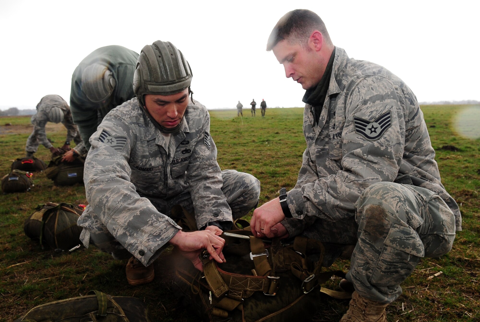 U.S. Air Force Tech. Sgt. Randal Komaki and Staff Sgt. Ronald Booth gather gear and prepare it for turn in after a multinational jump with the French paratroopers under French parachutes, March 4, 2010.  Members of the 435th Contingency Response Group and the 5th Quartermaster Company joined with their French military counterparts for a week of training at the École des troupes aéroportées (ETAP), or School of Airborne Troops, a military school dedicated to training the military paratroopers   of the French army, located in the town of Pau, in the département  of Pyrénées-Atlantiques , France.  The ETAP is responsible for training paratroopers, and for international cooperation and promotion of paratroop culture. (U.S. Air Force Photo by Staff Sgt. Jocelyn Rich)