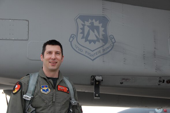 Maj. Anthony Dicarlo stands next to an Ore. Air National Guard F-15.  Dicarlo was named the 19th Air Force Air-to-Air Fighter Pilot Instructor of the Year 2009. (U.S. Air Force photo by Amn. Jennifer Reese, RELEASED)