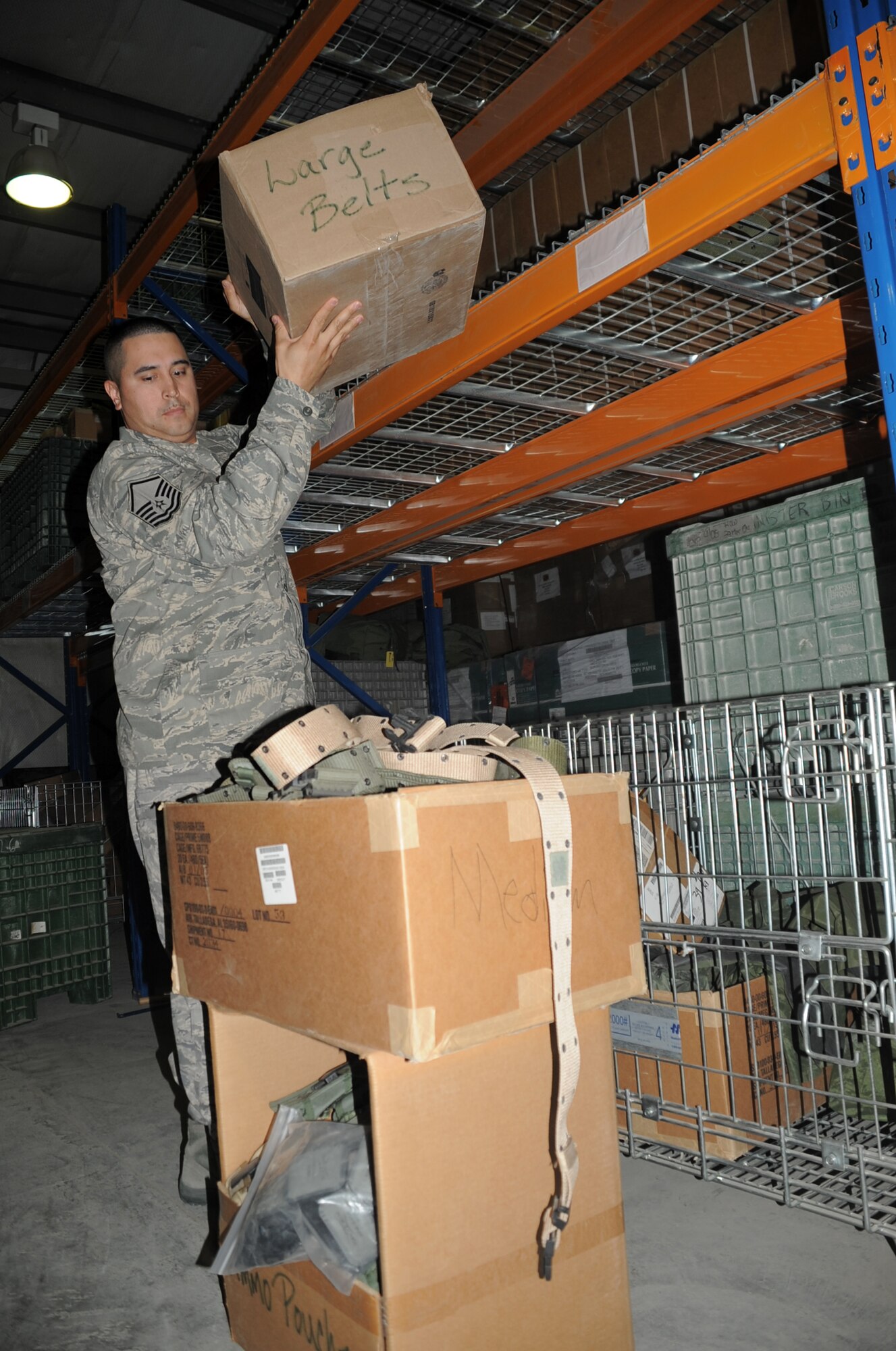 Master Sgt. Alex Brown moves boxes in the supply warehouse for the 380th Expeditionary Logistics Readiness Squadron at a non-disclosed base in Southwest Asia on March 6, 2010. Sergeant Brown is the superintendent of the ?Desert Depot,? otherwise known as the base supply store. Brown is a career material management Airman deployed with the 380th ELRS. He is deployed from the 161st Air Refueling Wing at Phoenix Sky Harbor Air National Guard Base, Ariz., and his hometown is Tolleson, Ariz. (U.S. Air Force Photo/Master Sgt. Scott T. Sturkol)