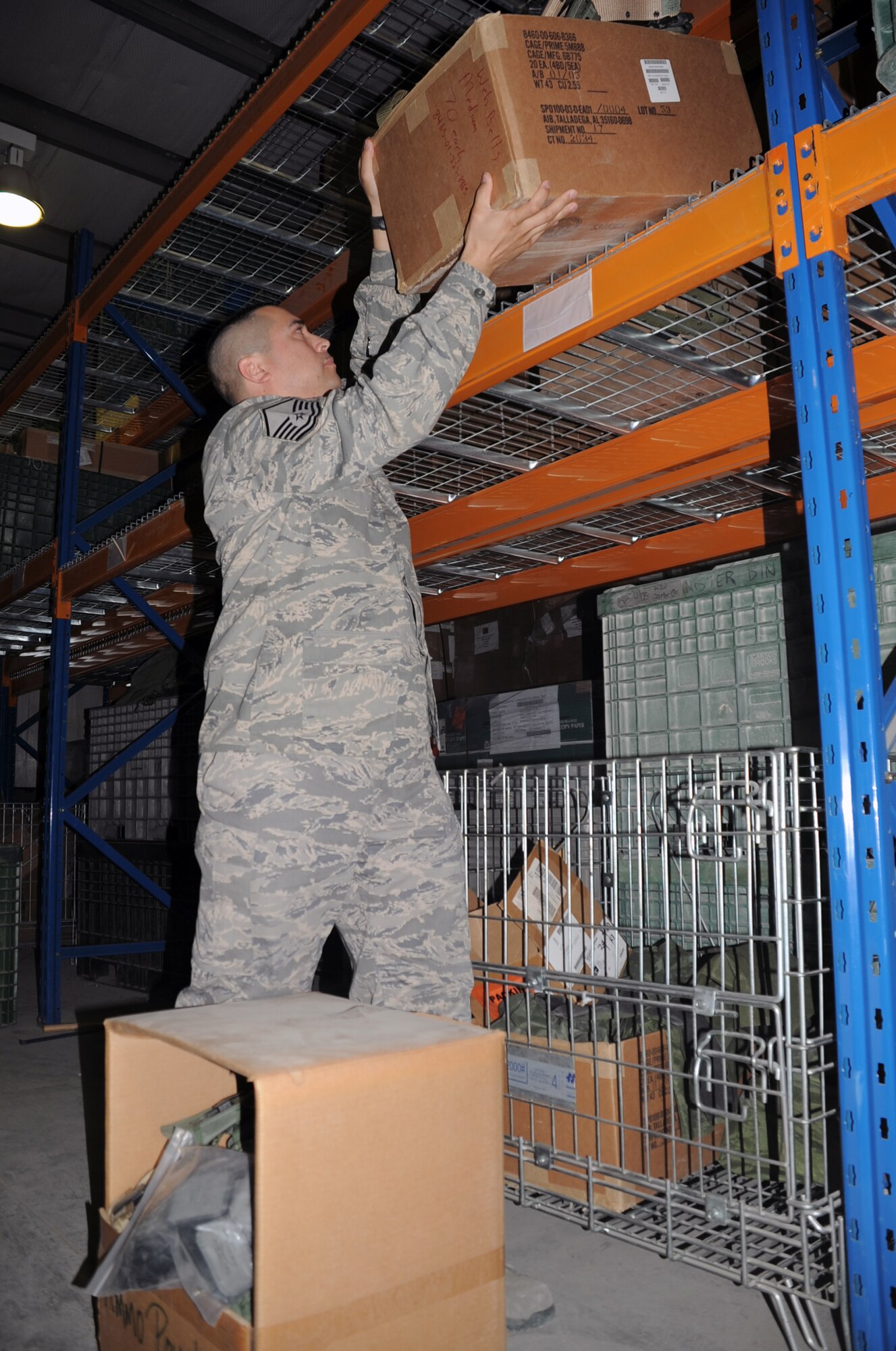 Master Sgt. Alex Brown moves boxes in the supply warehouse for the 380th Expeditionary Logistics Readiness Squadron at a non-disclosed base in Southwest Asia on March 6, 2010. Sergeant Brown is the superintendent of the ?Desert Depot,? otherwise known as the base supply store. Brown is a career material management Airman deployed with the 380th ELRS. He is deployed from the 161st Air Refueling Wing at Phoenix Sky Harbor Air National Guard Base, Ariz., and his hometown is Tolleson, Ariz. (U.S. Air Force Photo/Master Sgt. Scott T. Sturkol)