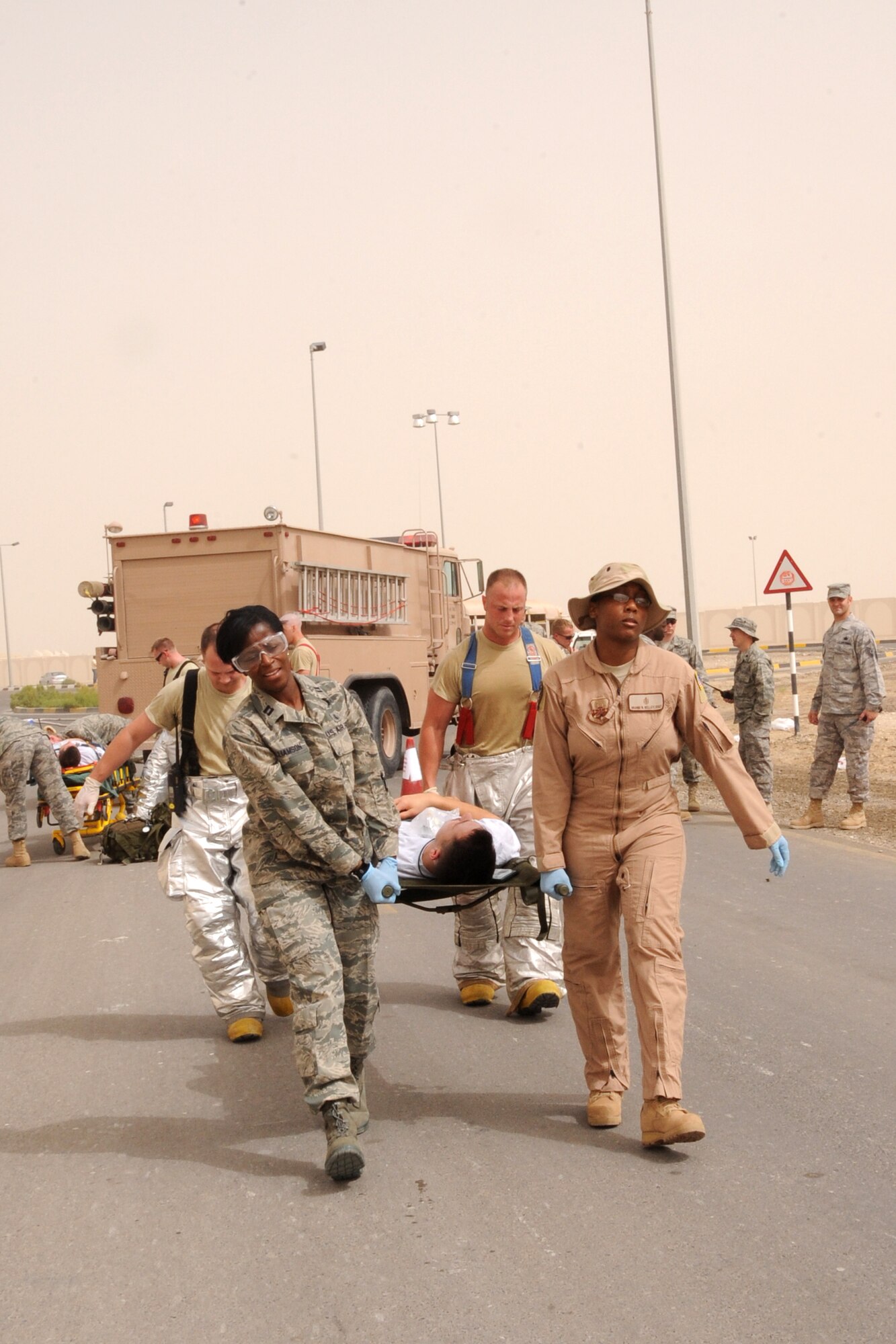 Members of the 380th Air Expeditionary Wing participate in the major accident response exercise at an undisclosed location in Southwest Aisa on March 6, 2010. Members of the wing participated in the exercise to test readiness and response to major accidents. The 380th AEW, supports Operations Iraqi Freedom and Enduring Freedom and the Combined Joint Task Force-Horn of Africa. The 380th AEW is comprised of four groups and 12 squadrons and the wing's deployed mission includes air refueling, surveillance and reconnaissance in support of overseas contingency operations in Southwest Asia. (U.S. Air Force photo/Senior Airman Jenifer H. Calhoun/Released)
