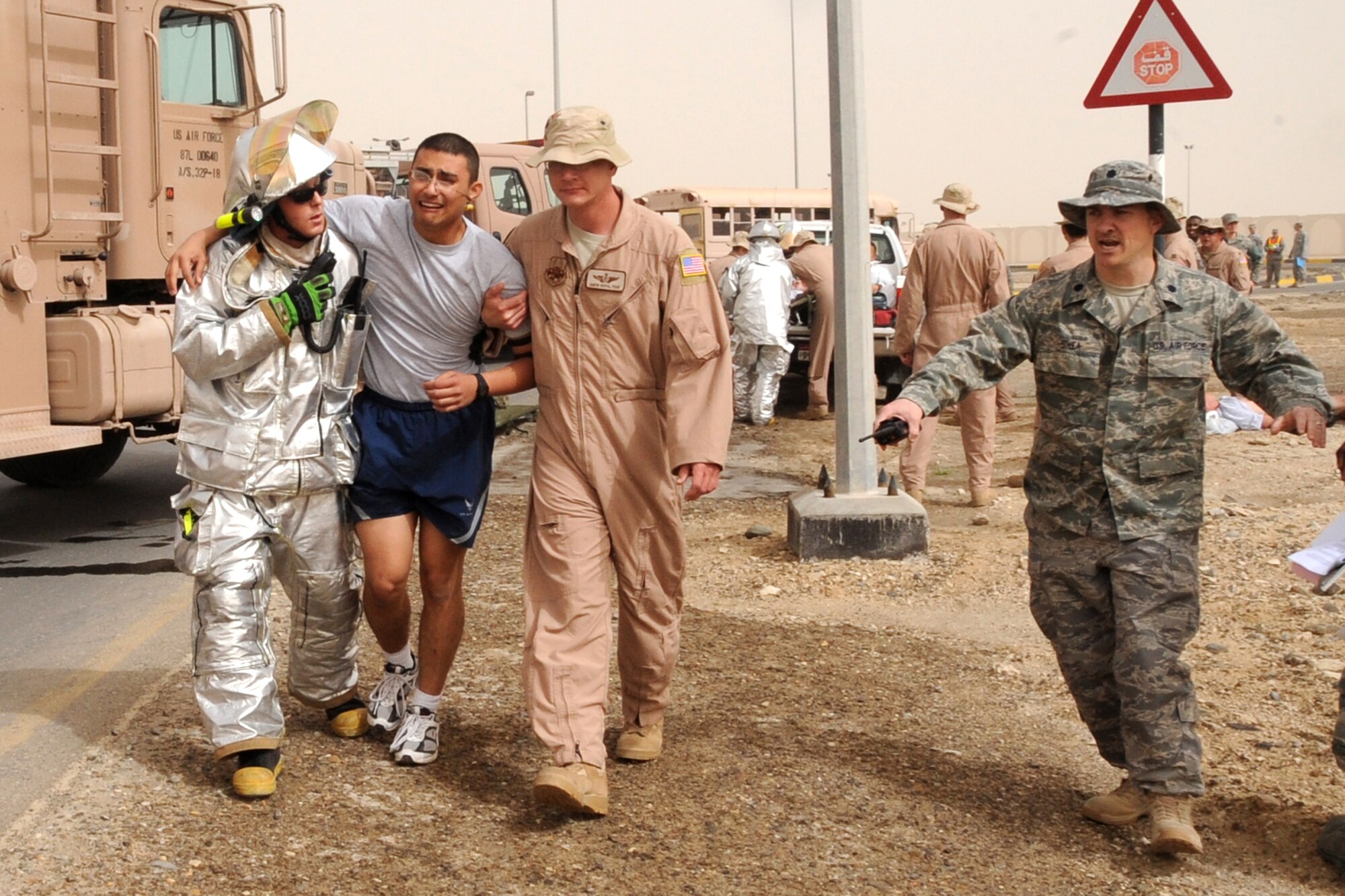 Members of the 380th Air Expeditionary Wing participate in the major accident response exercise at an undisclosed location in Southwest Aisa on March 6, 2010. Members of the wing participated in the exercise to test readiness and response to major accidents. The 380th AEW, supports Operations Iraqi Freedom and Enduring Freedom and the Combined Joint Task Force-Horn of Africa. The 380th AEW is comprised of four groups and 12 squadrons and the wing's deployed mission includes air refueling, surveillance and reconnaissance in support of overseas contingency operations in Southwest Asia. (U.S. Air Force photo/Senior Airman Jenifer H. Calhoun/Released)
