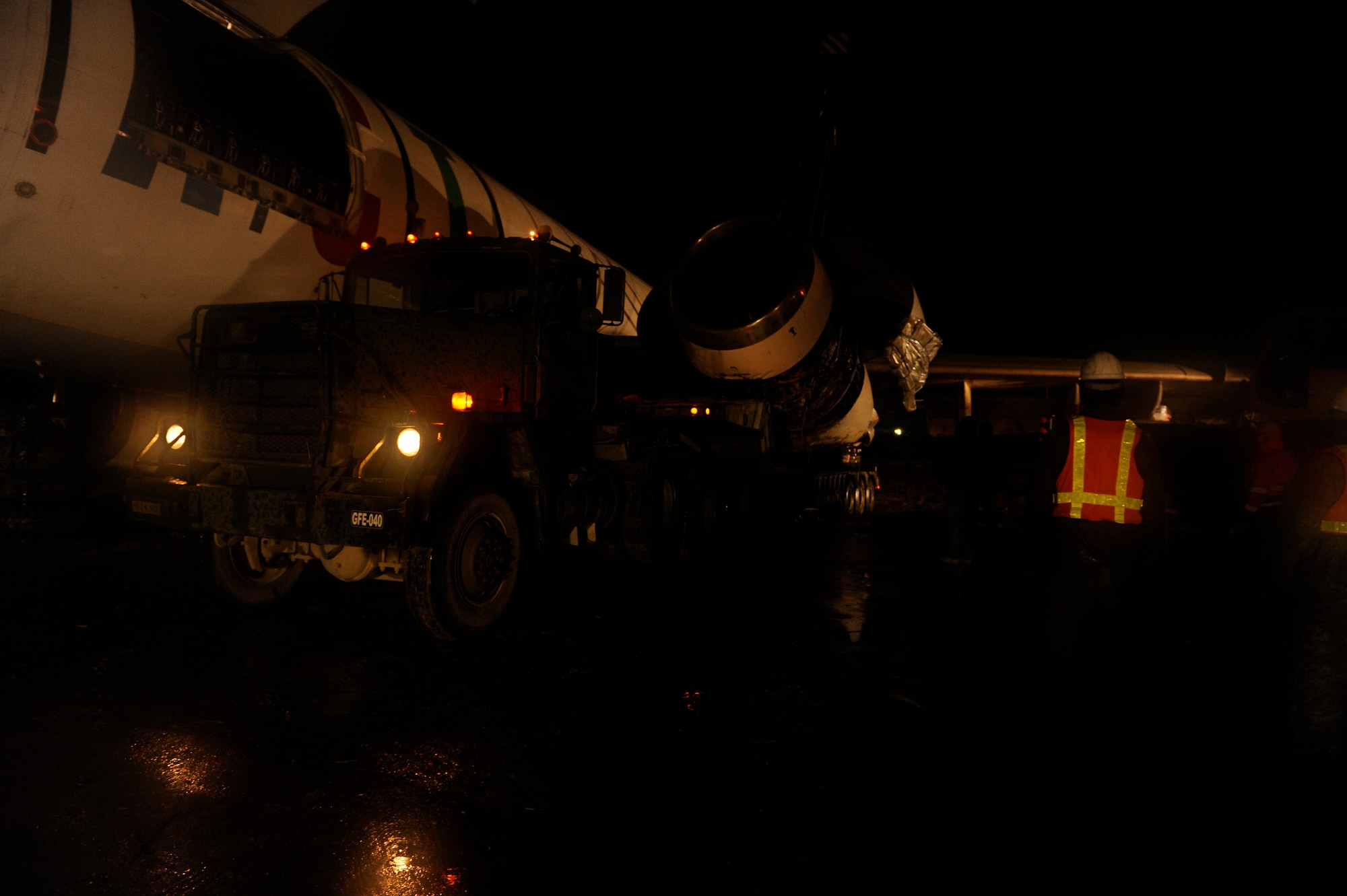 March 3, 2010, U.S. Air Force Airmen, Army Soldiers, and contractors move an Airbus A300 after its crew preformed an emergency landing at Bagram Airfield, Afghanistan, two days prior. (U.S. Air Force photo by/ Tech. Sgt. Jeromy K. Cross/released)