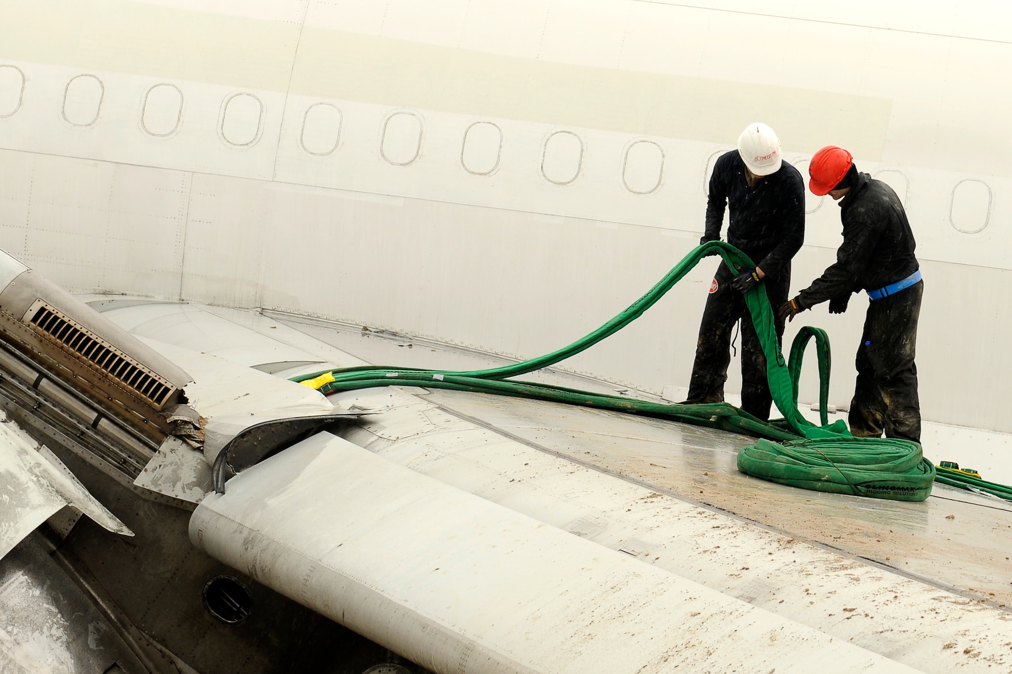 March 3, 2010, U.S. Air Force Airmen prepare to lift the wing of an Airbus A300 after its crew preformed an emergency landing at Bagram Airfield, Afghanistan, two days prior. (U.S. Air Force photo by/ Tech. Sgt. Jeromy K. Cross/released)
