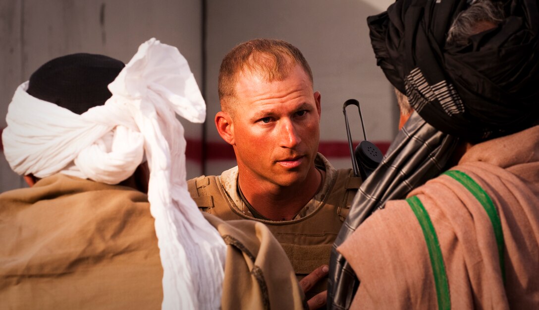 Capt. Shon S. Belcher, Kilo Company commander, 3rd Battalion, 3rd Marine Regiment, and a native of Fountain Hills, Ariz., talks to role players acting as a village elder and sub governor during the Clear, Hold, Build Exercise 2 at Range 210 at Marine Corps Air Ground Combat Center Twentynine Palms, Calif. March 6. The two-day exercise acted as an introduction to counterinsurgency. On the second day of the exercise Marines interacted with Afghani role players and helped them return to a village the Marines had cleared of insurgents the day before.