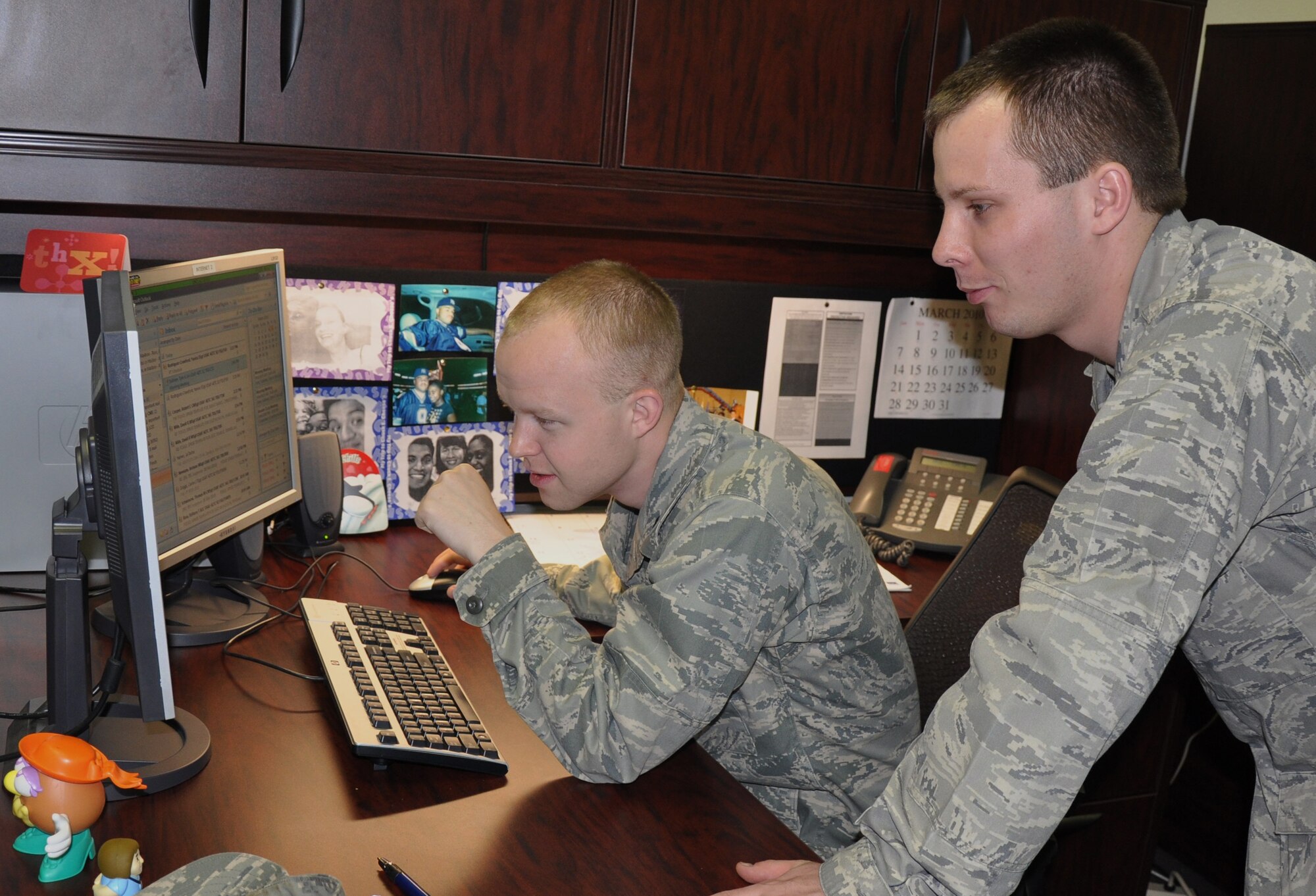 1st Lt. Steven Cosgrove (left), 82nd Force Support Squadron assistant operations officer, is shadowed at his workplace by Cadet Colonel Ryan Curran, a senior with the Air Force Reserve Officer Training Corps, March 5. Eleven cadets visited the base to shadow  82nd Logistics Readiness Squadron, 82nd Judge Advocate, 82nd Force Support Squadron, 82nd Contracting Squadron and pilot training. (U.S. Air Force/Airman 1st Class Valerie Hosea)