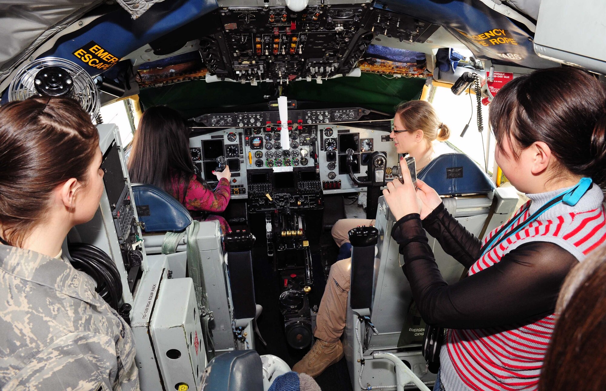 Capt. Melanie Barnes, a KC-135 pilot, shows female students from the Kyrgyz Law Academy the cockpit of a Stratotanker on the flight line here March 6, 2010. The Kyrgyz Law Academy sent several of their female students to the installation, where many female Airmen briefed them on the operations here. This was planned in honor of Women’s Day, a national Kyrgyz holiday. (U.S. Air Force photo/Staff Sgt. Carolyn Viss/released)