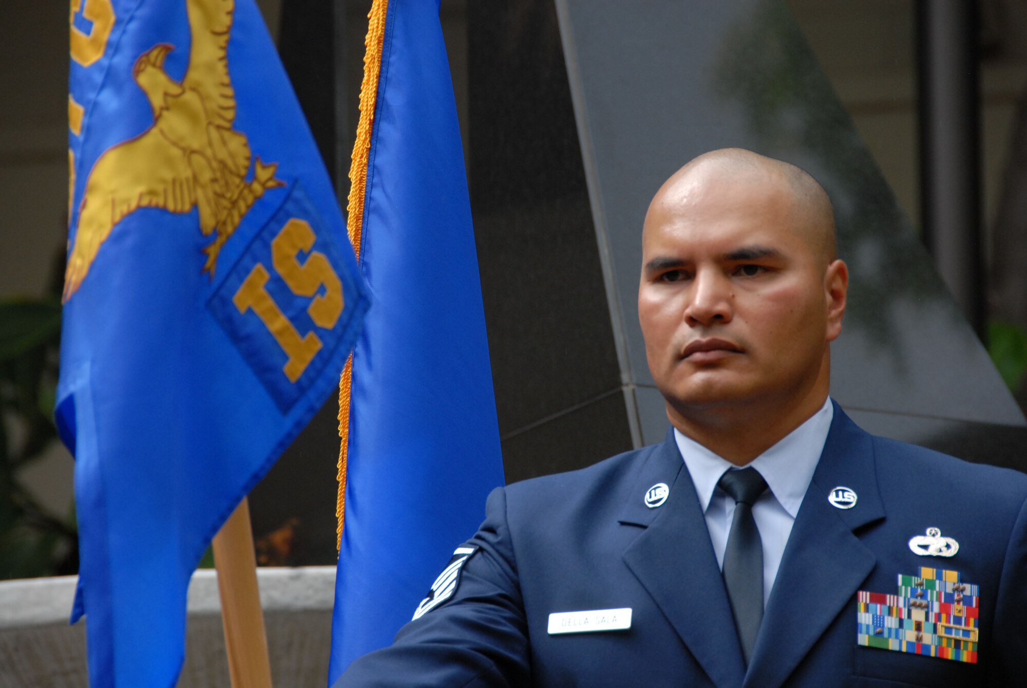 Master Sgt. Marcus Della Sala holds the unit flag during the 201st Intelligence Squadron's unit actvation ceremony at the Courtyard of Heroes, PACAF Headquarters, Joint Base Pearl-Harbor-Hickam AFB, HI. March 7, 2010.  (U.S. Air Force Photo, A1C Orlando Corpuz)
