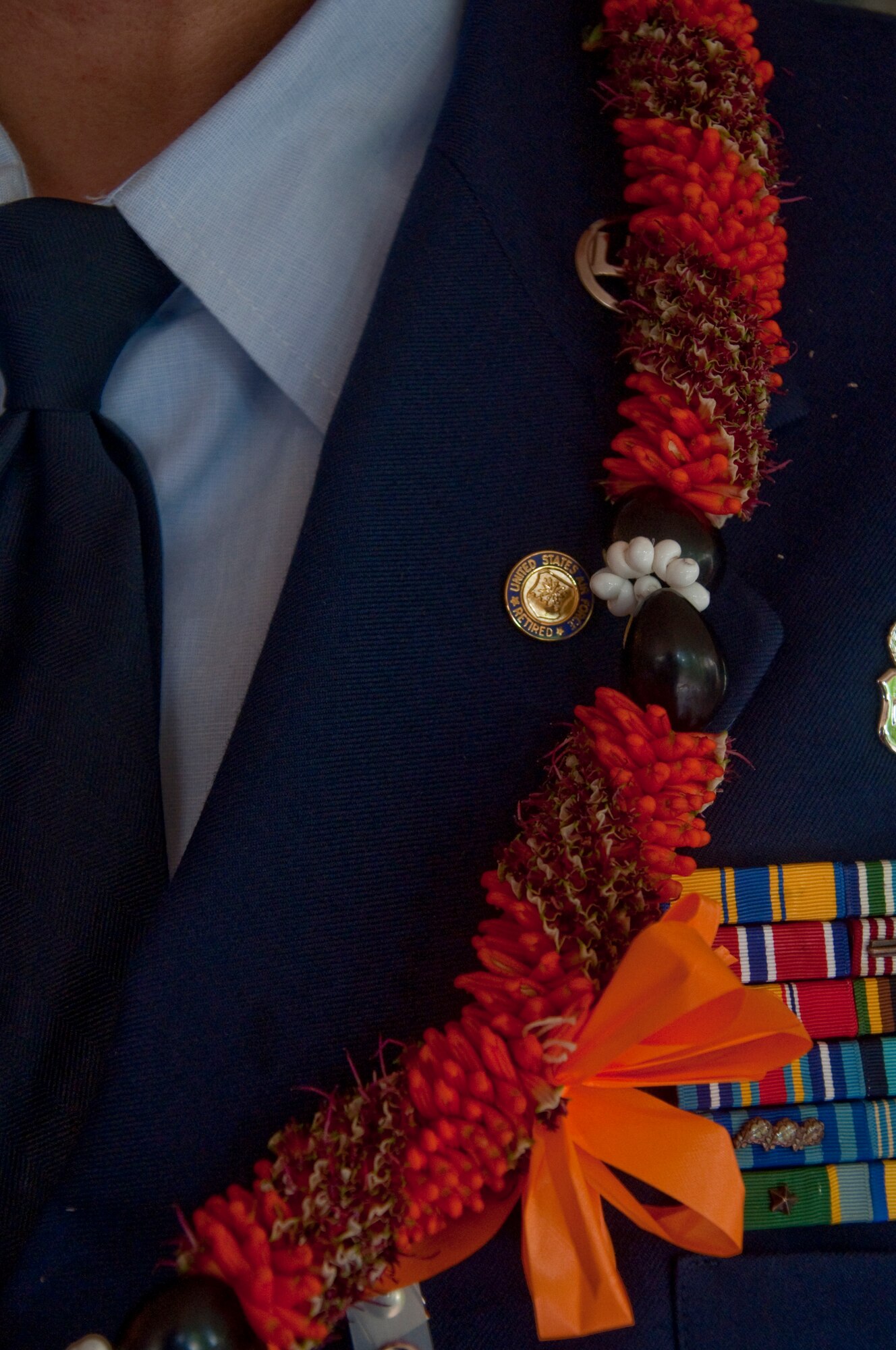 Close up on the retirement pin of Chief Master Sgt. Richard G. Fikani Jr. placed there by his wife.

Chief Fikani began his military career by enlisting in the United States Army in December 1981. After completing nine years of active duty, he ended his Army career and settled in Honolulu, Hawaii. He then enlisted into the U.S. Air Force Reserve in November 1991 where he remained till his retirement. (U.S. Air Force photo/Master Sgt. Daniel Nathaniel)