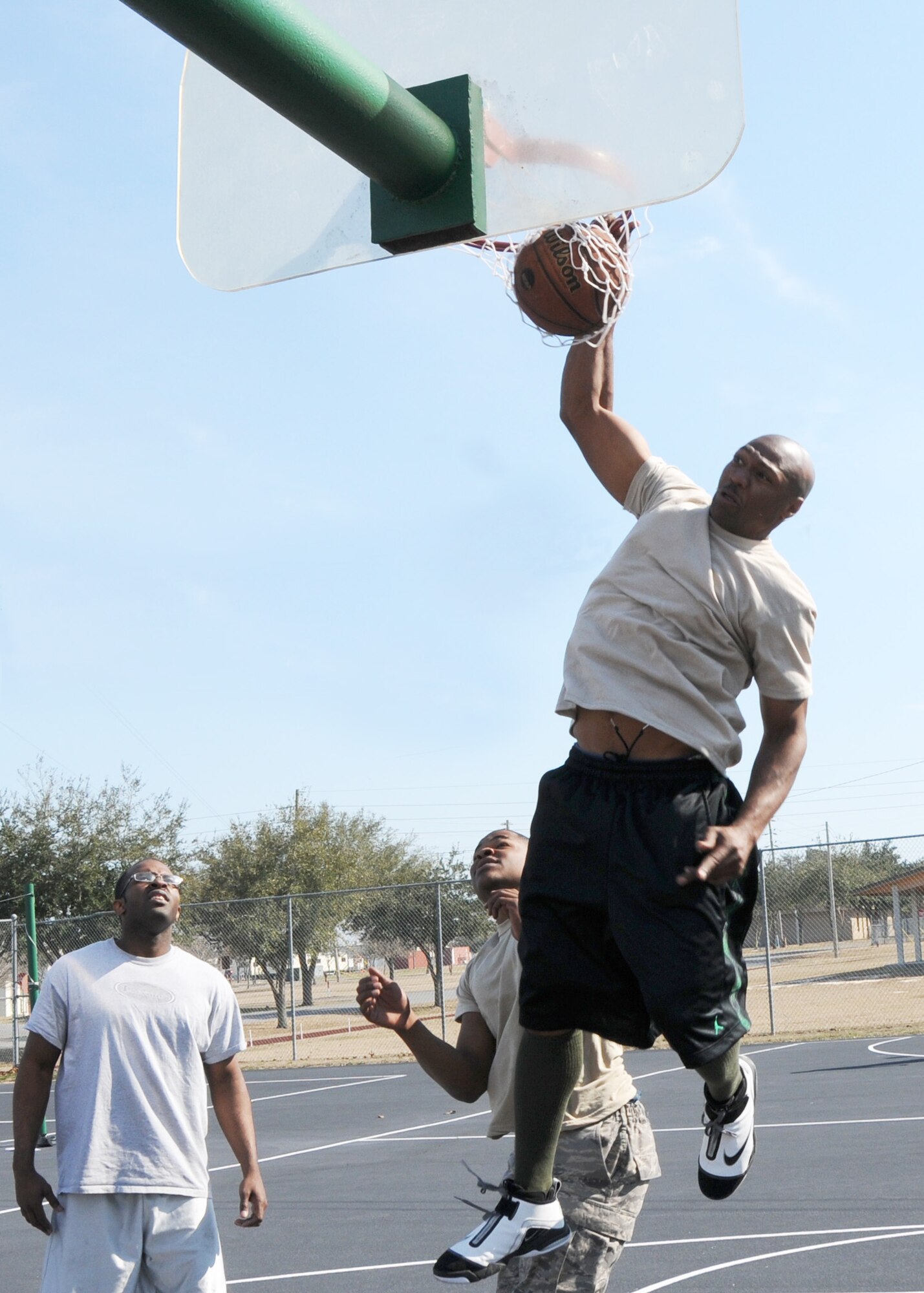 Damien Fantroy dunks the ball during the first game of the three-on-three basketball tournament March 7 at Duke Field. The winning team won two straight games in the single-elimination tournament to win.  (U.S. Air Force photo/Tech. Sgt. Samuel King Jr.)