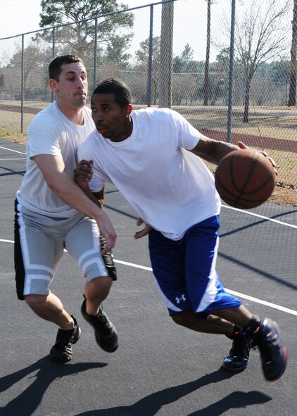 Steven Taylor drives to the basket during the second game of the three-on-three basketball tournament March 7 at Duke Field. The winning team won two straight games in the single-elimination tournament to win.  (U.S. Air Force photo/Tech. Sgt. Samuel King Jr.)