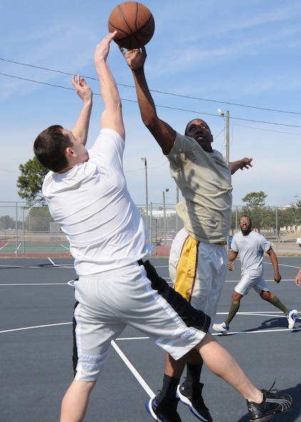 David Cason blocks a shot during during the three-on-three basketball tournament March 7 at Duke Field.  Cason’s team won two straight games in the single-elimination tournament to win.  (U.S. Air Force photo/Tech. Sgt. Samuel King Jr.)