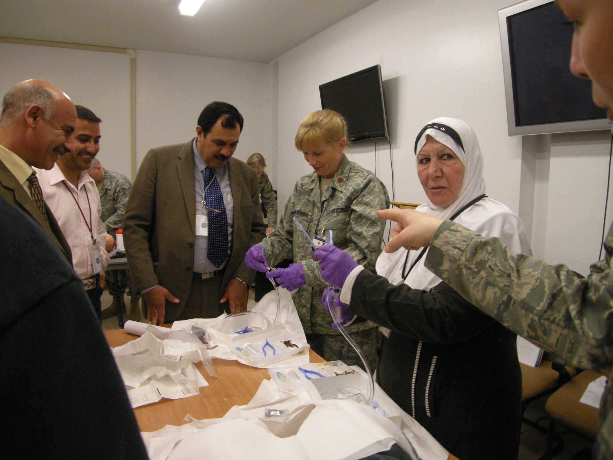 Air Force medical staff deployed to the 332nd CASF, Joint Base Balad, Iraq, teaches Iraqi nurses about Intravenous access and therapy. Intravenous therapy, more commonly referred to as an IV, is used to administer fluids and medications directly to the veins. (Courtesy Photo)