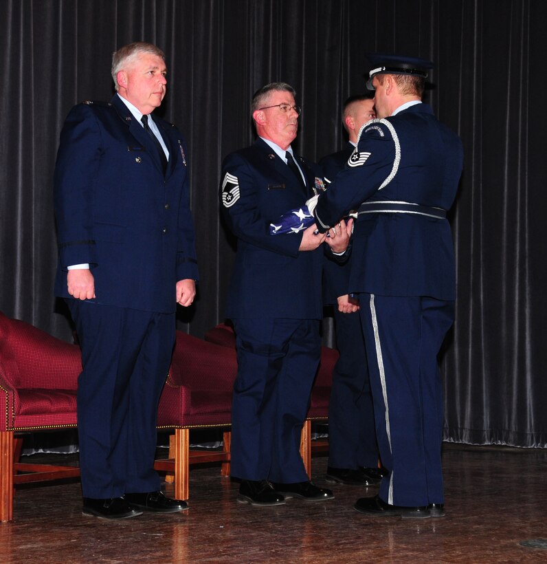 NIAGARA FALLS AIR RESERVE STATION, NY-- Chief Master Sgt Charles E. Craven receives the United States flag in recognition of his many years of service and dedication to his country, March 6, 2010.  (U.S. Air Force photo by Staff Sgt Stephanie Clark) (Released)