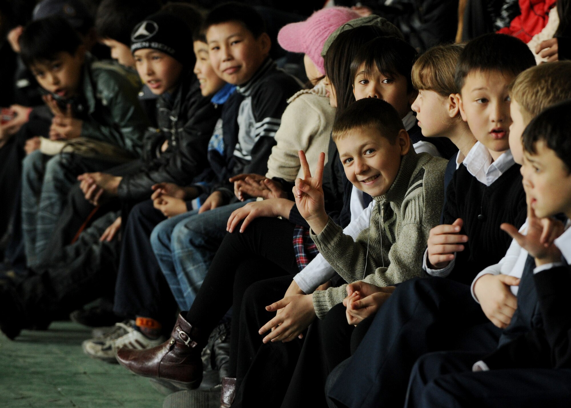 Spectators cheer during a women's basketball game against the Transit Center at Manas at the Palace of Sport in Bishkek, Kyrgyzstan, March 5, 2010. The friendly game hosted by the U.S. Embassy was to honor International Women's Day, which is celebrated annually on March 8.  (U.S. Air Force photo/Senior Airman Nichelle Anderson/released)