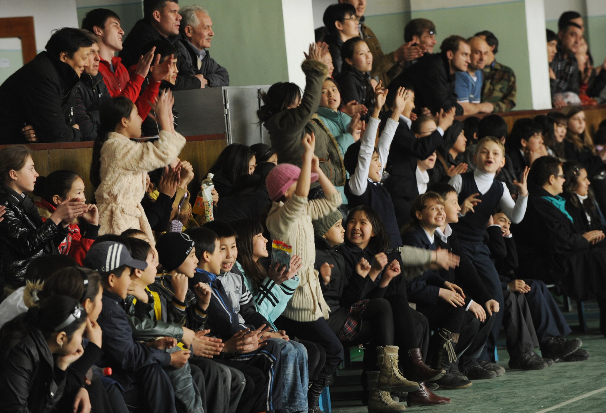 Spectators cheer during a women's basketball game against the Transit Center at Manas at the Palace of Sport in Bishkek, Kyrgyzstan, March 5, 2010. The friendly game hosted by the U.S. Embassy was to honor International Women's Day, which is celebrated annually on March 8.  (U.S. Air Force photo/Senior Airman Nichelle Anderson/released)