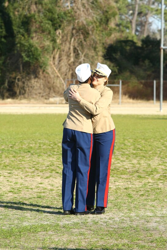 MARINE CORPS BASE CAMP LEJEUNE, N.C.– Master Gunnery Sgt. Marcia McLaurin, family readiness officer with Headquarters and Support Battalion, Marine Corps Base Camp Lejeune, and Col. Susan B. Seaman, commanding officer of Headquarters and Support Battalion, Marine Corps Base Camp Lejeune, share a hug at the conclusion of McLaurin’s retirement ceremony at Liversedge Field, March 8.