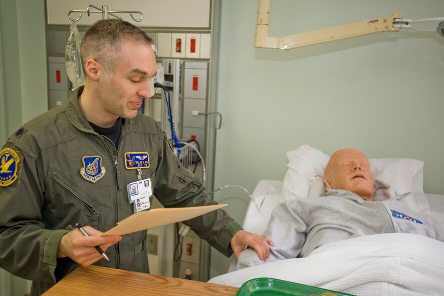 Lt. Col. Talib Ali, 35th Medical Group flight surgeon, performs patient assessment during a patient safety-treasure hunt March 8, 2010, at Misawa Air Base, Japan. During the "treasure hunt," Colonel Ali found and corrected any prepositioned, unsafe practices that were present. The exercise was in part of National Patient Safety Week at the medical group. (U.S. Air Force photo/Senior Airman Jamal D. Sutter) 
