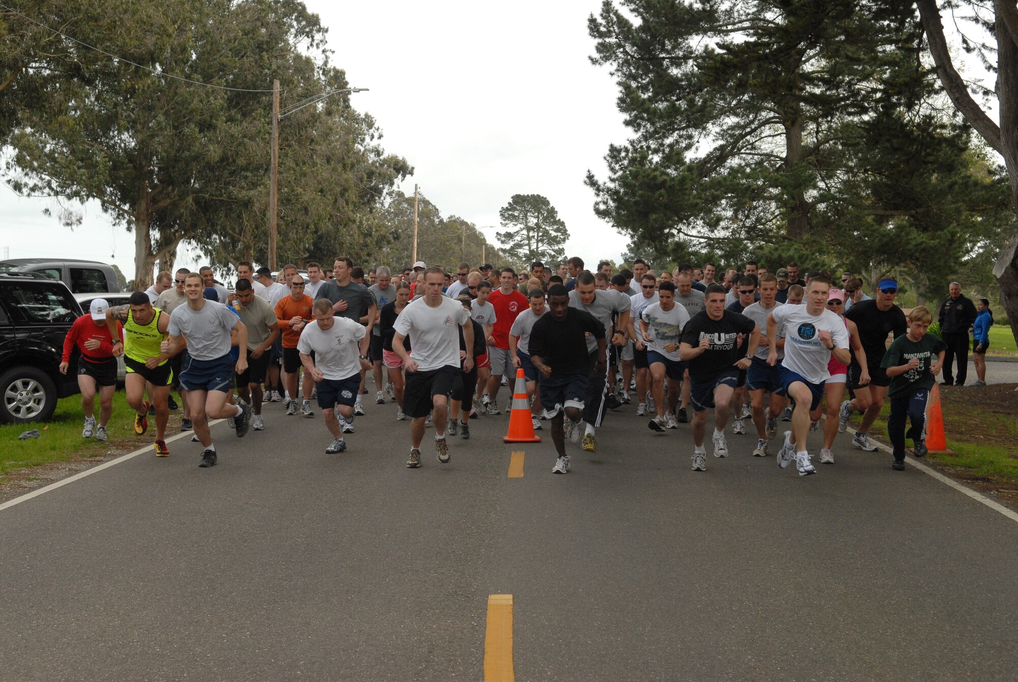 VANDENBERG AIR FORCE BASE, Calif. - - Kicking off the start of the Guardian Challenge 5K Run, the participants start the race here Friday, March 5, 2010. The run started and finished at Cocheo Park here and was followed up by a barbecue hosted by the Noncommissioned Officers Association. (U.S. Air Force photo/Airman 1st Class Angelina Drake)