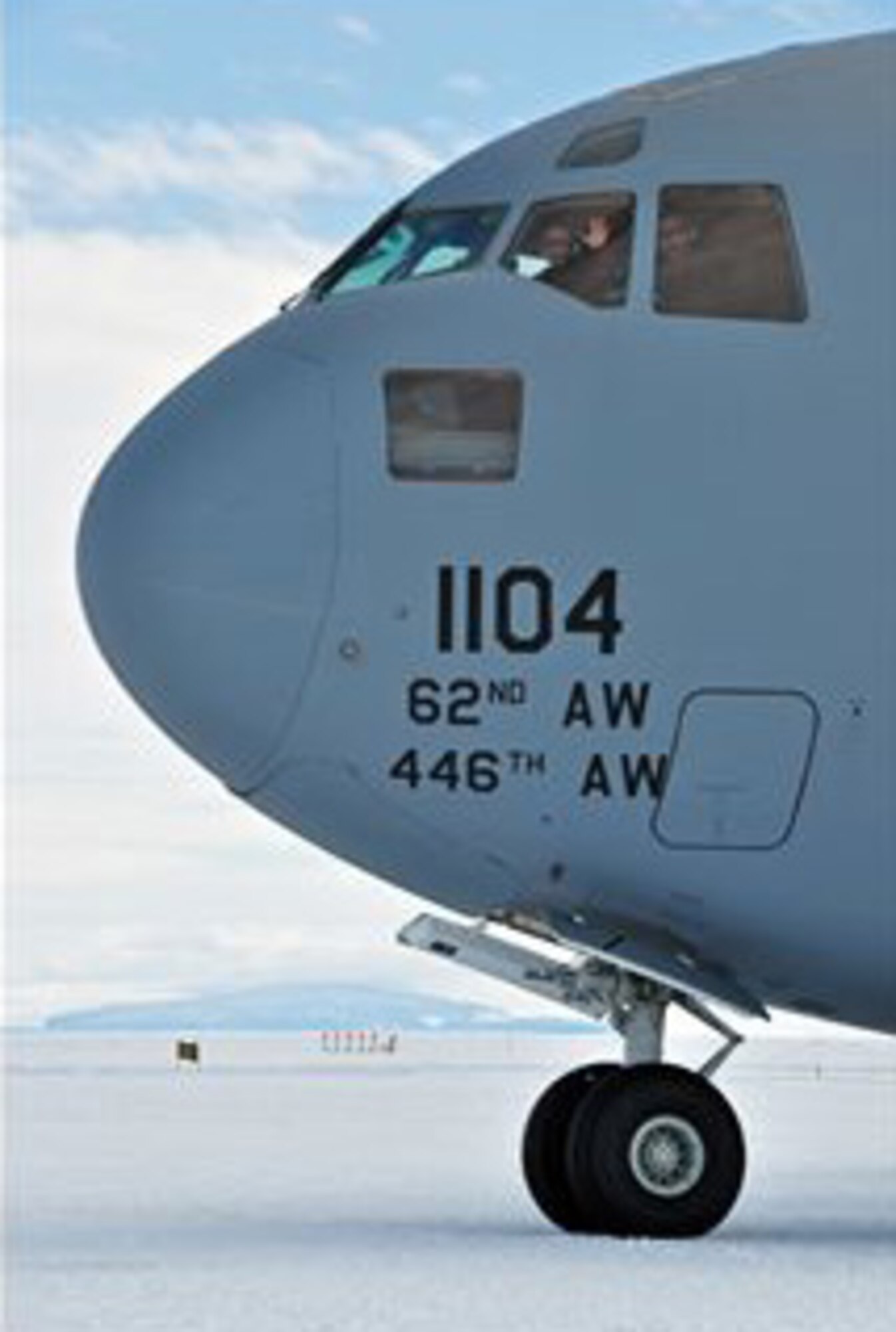 PEGASUS FIELD, Antarctica- Lt. Col. Colin Keen, 313th Airlift Squadron pilot out of Joint Base Lewis-McChord, Wash., gives a friendly wave before starting engines while detailing aircraft commander duties with Capt. Daniel Gasper, 728th Airlift Squadron pilot, also out of JBLM McChord Field, during an Operation Deep Freeze mission here. (U.S. Air Force photo/Staff Sgt. Robert Tingle)