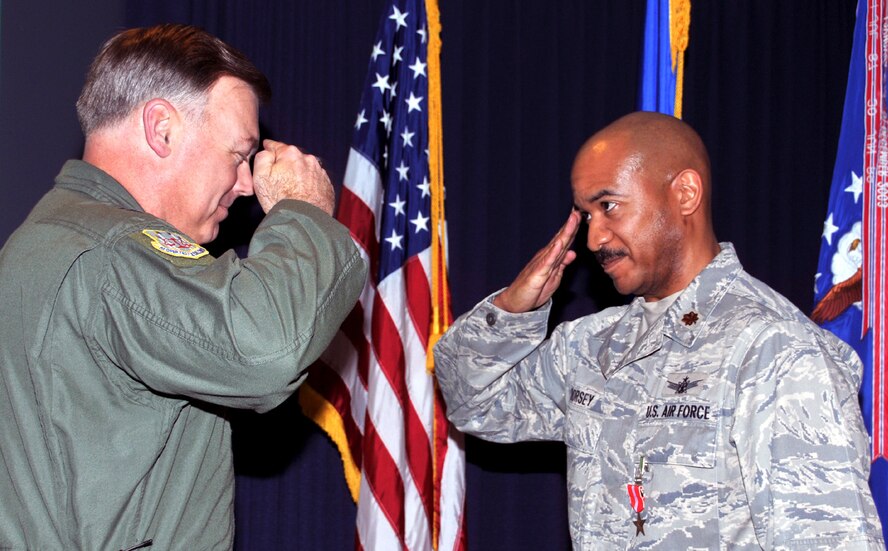 Air Force Operational Test and Evaluation Center Commander Maj. Gen. Stephen T. Sargeant presents the Bronze Star to Maj. Hamilton L. Dorsey for his actions while deployed to Iraq during a Feb. 5, 2010 AFOTEC Commander's Call at Kirtland Air Force Base, N.M.