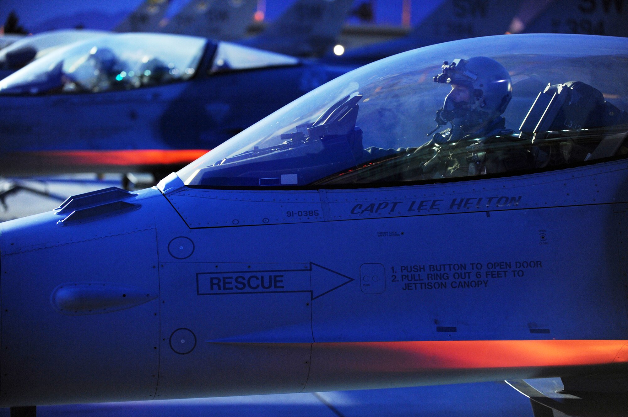 A pilot from the 55th Fighter Squadron at Shaw AFB, S.C., completes pre-flight checks in an F-16 Fighting Falcon before a night training mission at Red Flag Feb. 23, 2010, at Nellis Air Force Base, Nev. Red Flag is a realistic combat training exercise involving the air forces of the United States and its allies. (U.S. Air Force photo/Tech. Sgt. Michael R. Holzworth)