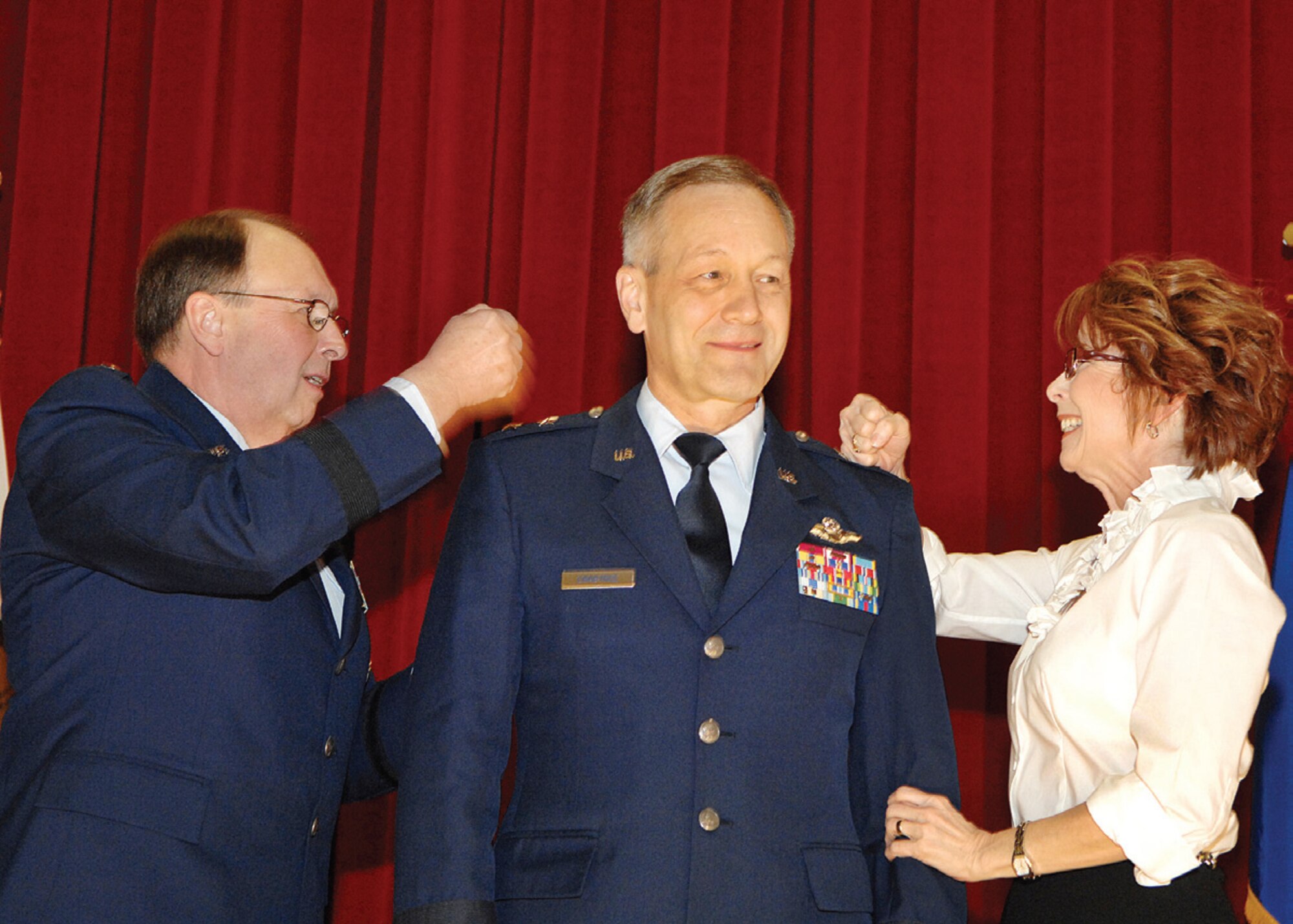 Mrs. Beth Crabtree (right) and Chief of the Air Force Reserve, Lt. Gen. Charles E. Stenner, Jr. (left), pin second stars on the shoulders of Fourth Air Force commander, Maj. Gen. Eric W. Crabtree, at General Crabtree’s pinning ceremony at the Cultural Resources Center on base, Feb. 20. A reception at the Hap Arnold Club followed the ceremony. (U.S. Air Force Photo/ Staff Sgt. Stephen D. Schester)