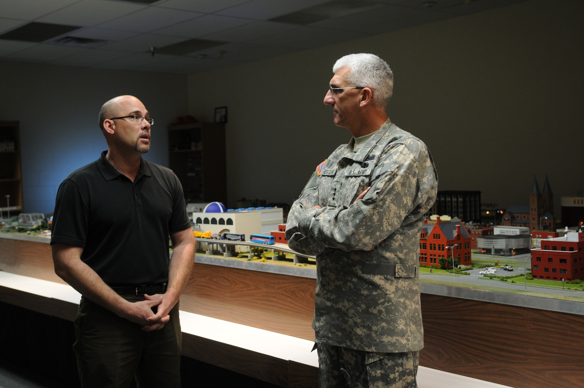 GOODFELLOW AIR FORCE BASE, Texas -- Leon Lamoy, 312th Training Squadron, briefs Lt. Gen. Mark Hertling, on the Command and Control simulator at the Louis F. Garland Department of Defense Fire Academy, March 4, 2010. General Hertling, Deputy Commanding General for Initial Military Training, U.S. Army Training and Doctrine Command, visited Goodfellow to observe training. (U.S. Air Force photo/Airman 1st Class Clayton Lenhardt)