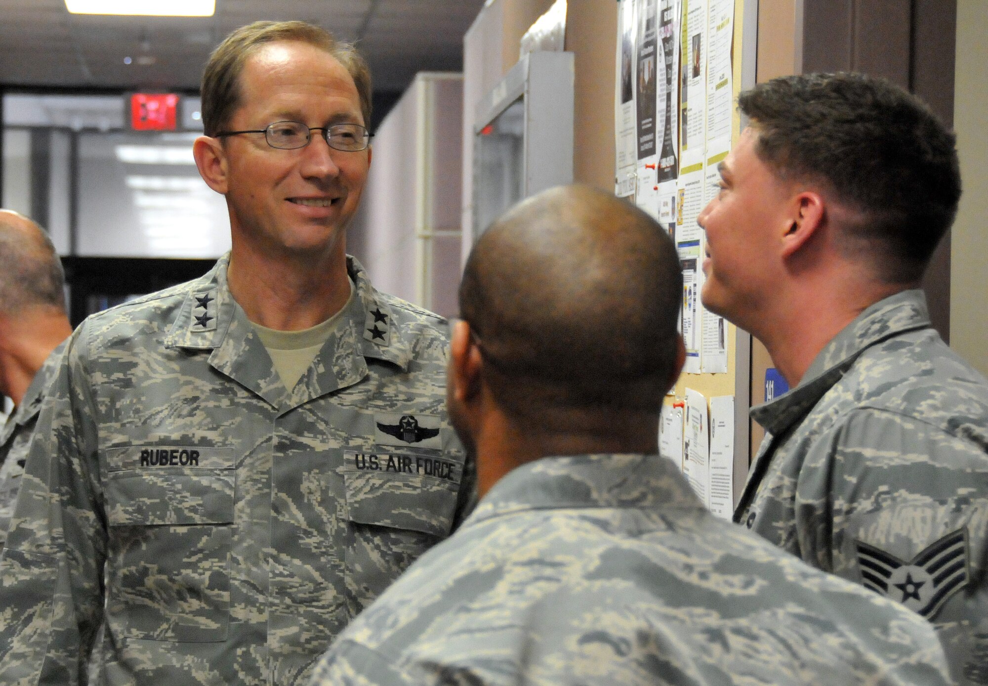 Maj. Gen. James Rubeor, 22nd Air Force commander, discusses pilot training with Staff Sgt. James Selig, job title, and Name, job title, while touring the 403rd Mission Support Group March 5, 2010. General Rubeor visited the 403rd Wing at Keesler Air Force Base, Miss., March 5-7 as part of his commitment to visit all of the wings assigned to 22nd AF. (U.S. Air Force photo by Senior Airman Kimberly Erickson)