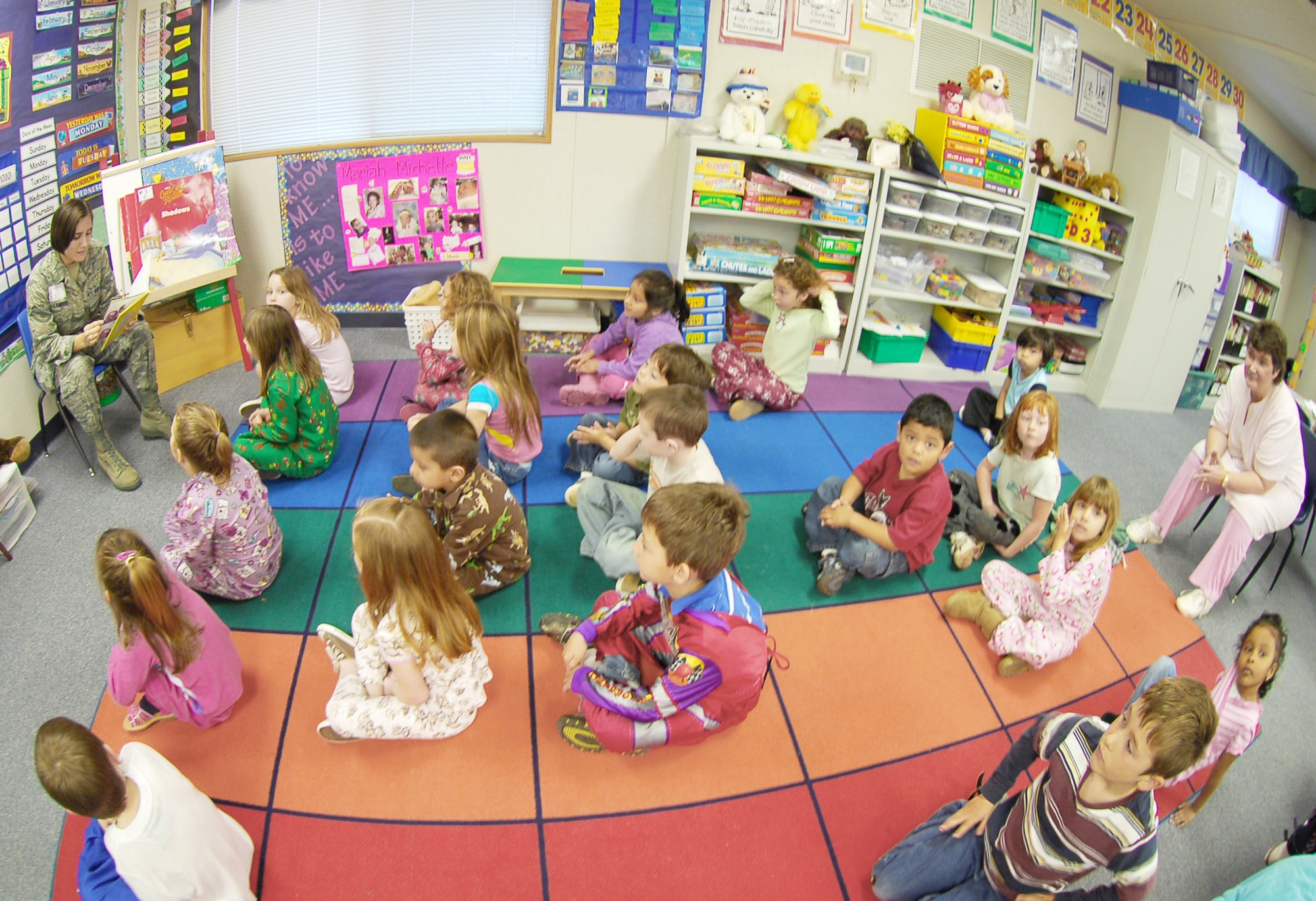 Airman Hayley Lambert reads a Dr. Suess book to children at Arboga Elementary School, March 2, 2010, at Beale Air Force Base, Calif. Airman Lambert took part in a nationwide event Read across America, which happens around Dr. Suess's birthday. Airman Lambert is from the 9th Communications Squadron. (U.S. Air Force photo/Senior Airman Kevin Iinuma)

