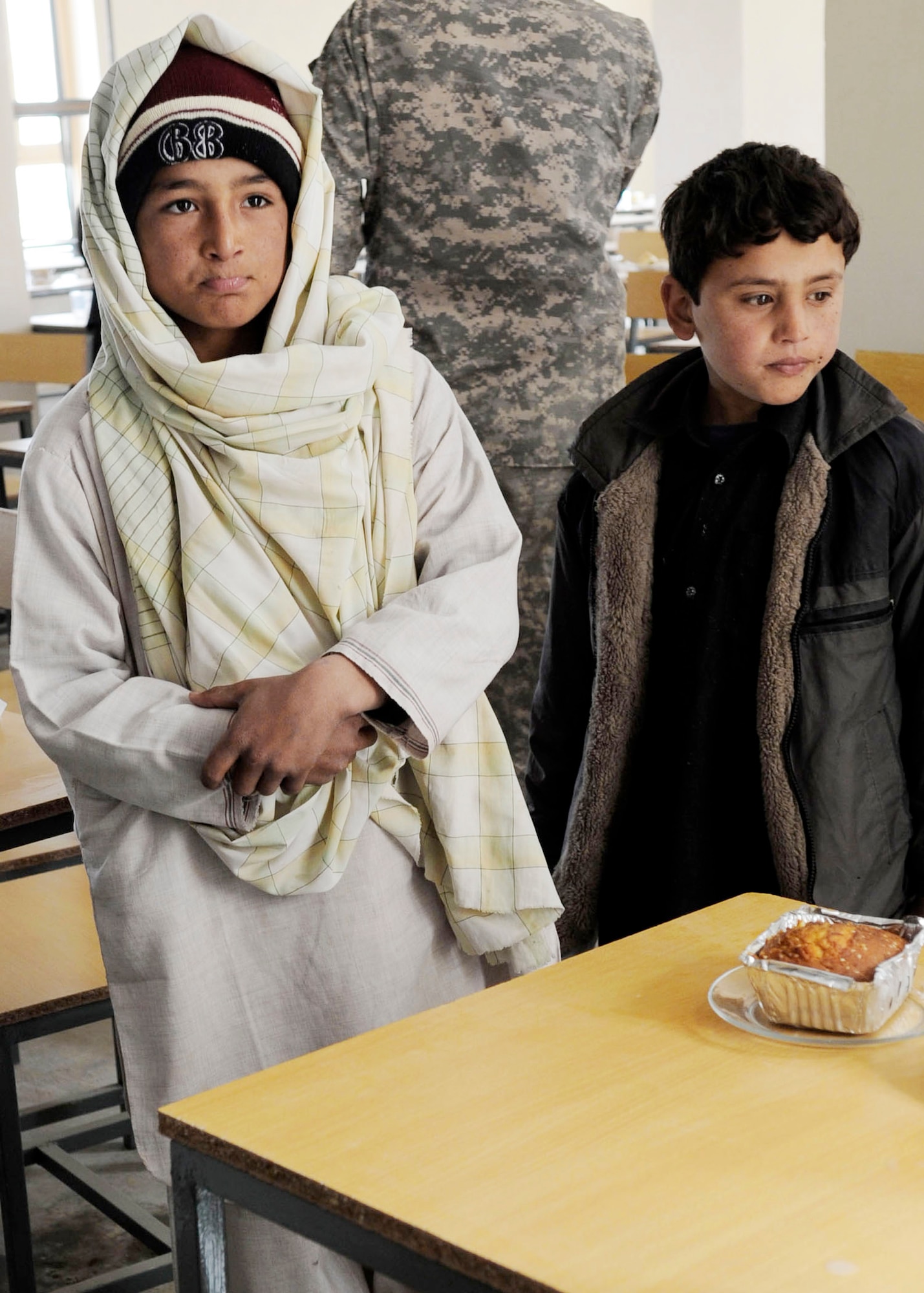 Afghan children attend the opening ceremony of the Sheik Mati Boy's High School Feb. 25, 2010 in Qalat City of the Zabul Province in Afghanistan (U.S. Air Force photo/Senior Airman Nancy Hooks)