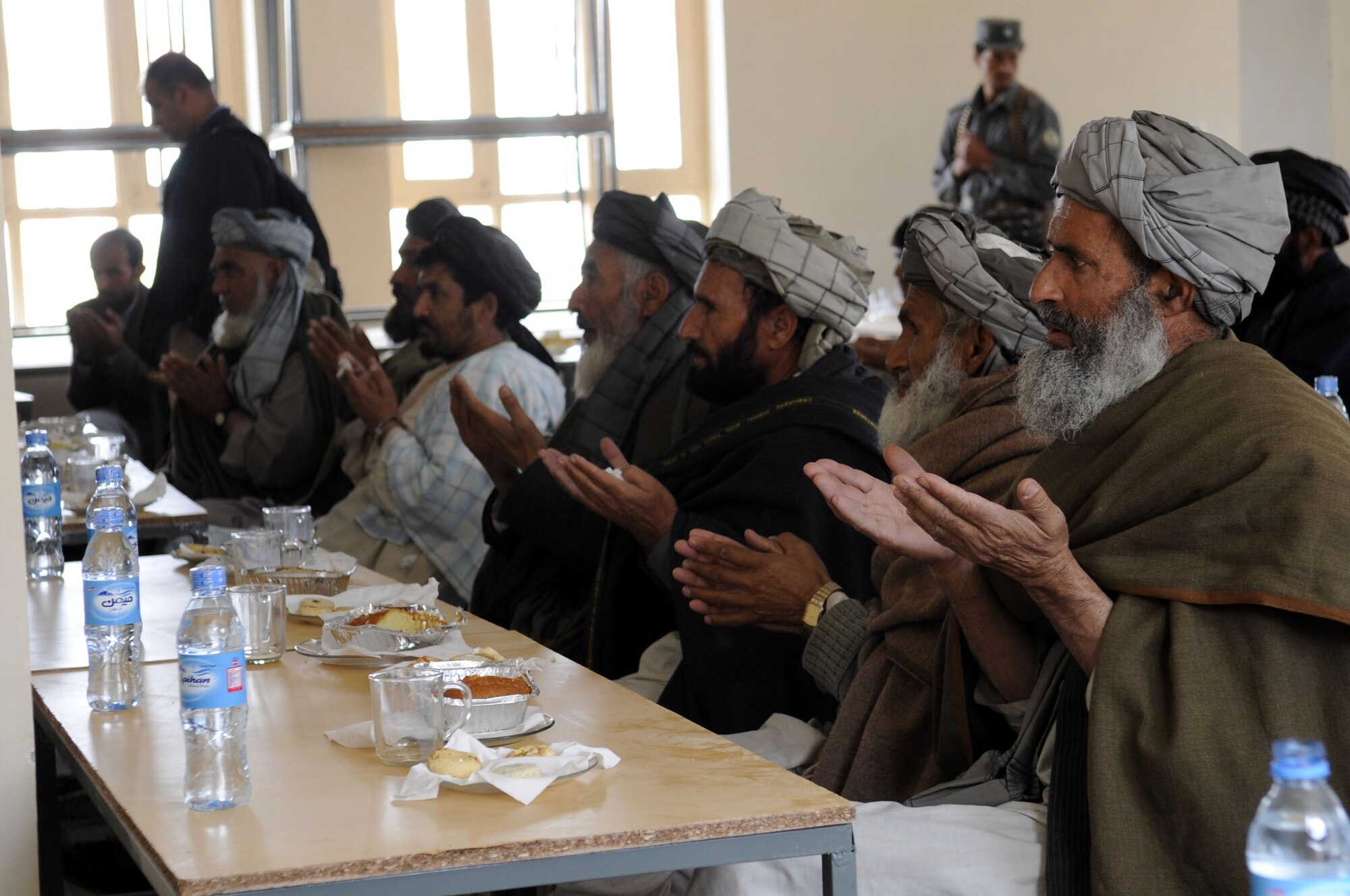 Village elders pray during the opening of the Sheik Mati Boy's High School Feb. 25, 2010, in Qalat city of the Zabul Province in Afghanistan. (U.S. Air Force photo/Senior Airman Nancy Hooks)