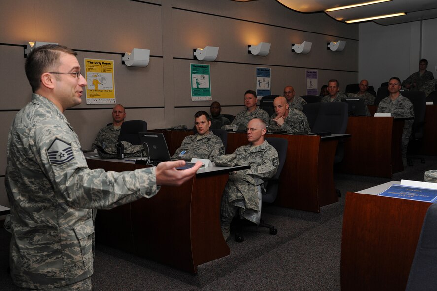 Master Sgt. Scott Krzysik, U.S. Air Force Expeditionary Center Mobility Operations School instructor, shows the maintenance training simulator to a group of visiting Air Mobility Command Chief Master Sergeants March 3.  The command chiefs learned how the training simulator provides a real-world experience to the students. (U.S. Air Force Photo/Staff Sgt. Nathan G. Bevier)