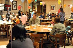 Families come out to enjoy some food and fun during Family Night at the Charleston Club March 4, 2010, at Joint Base Charleston, S.C. The Charleston Club hosts Family Night the first Thursday of every month. The next scheduled Family Night is set for April 1, 2010. (U.S. Air Force photo/Staff Sgt. Marie Brown)