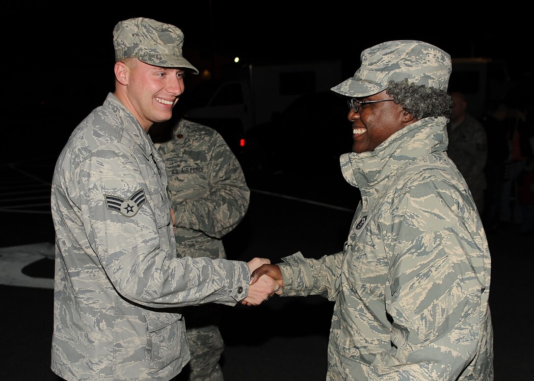 LANGLEY AIR FORCE BASE, Va. -- Senior Airman David Erb, 633d Logistics Readiness Squadron vehicle operator and dispatcher, is greeted by Senior Master Sgt. Andreanetta Hollowell, 633 LRS first sergeant, during his homecoming March 5. Airman Erb and eight others deployed 200 days as Air Force Combat Convoy Vehicle Operators in support of the 586th Expeditionary Logistics Readiness Squadron at Camp Arifjan, Kuwait . (U.S. Air Force photo/Airman Rebecca Montez)