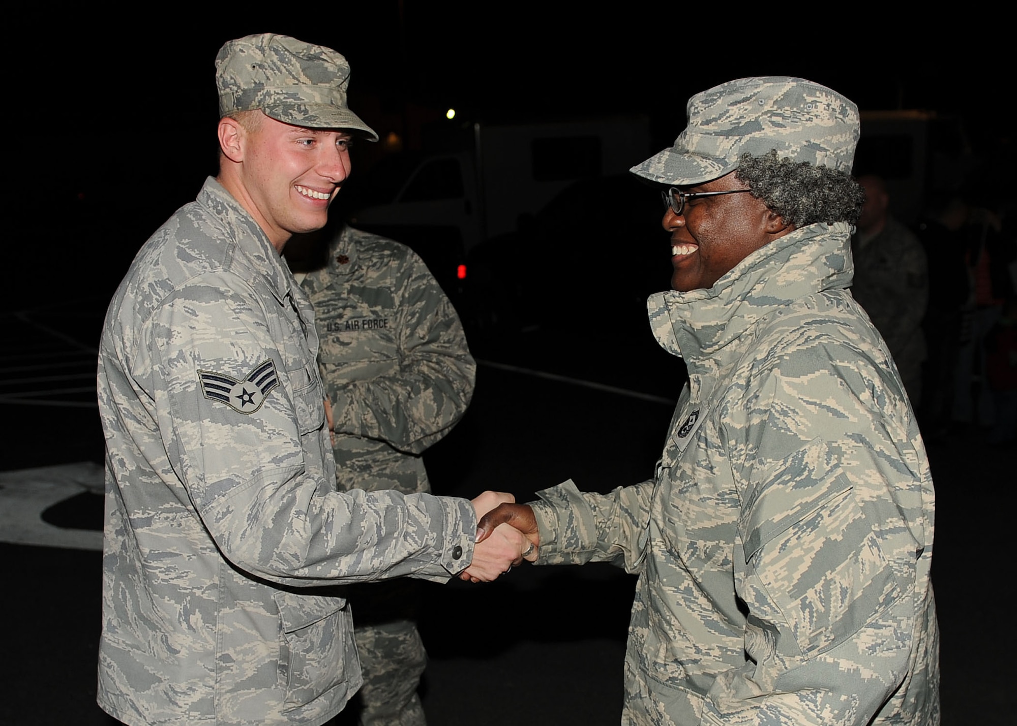 LANGLEY AIR FORCE BASE, Va. -- Senior Airman David Erb, 633d Logistics Readiness Squadron vehicle operator and dispatcher, is greeted by Senior Master Sgt. Andreanetta Hollowell, 633 LRS first sergeant, during his homecoming March 5. Airman Erb and eight others deployed 200 days as Air Force Combat Convoy Vehicle Operators in support of the 586th Expeditionary Logistics Readiness Squadron at Camp Arifjan, Kuwait . (U.S. Air Force photo/Airman Rebecca Montez)