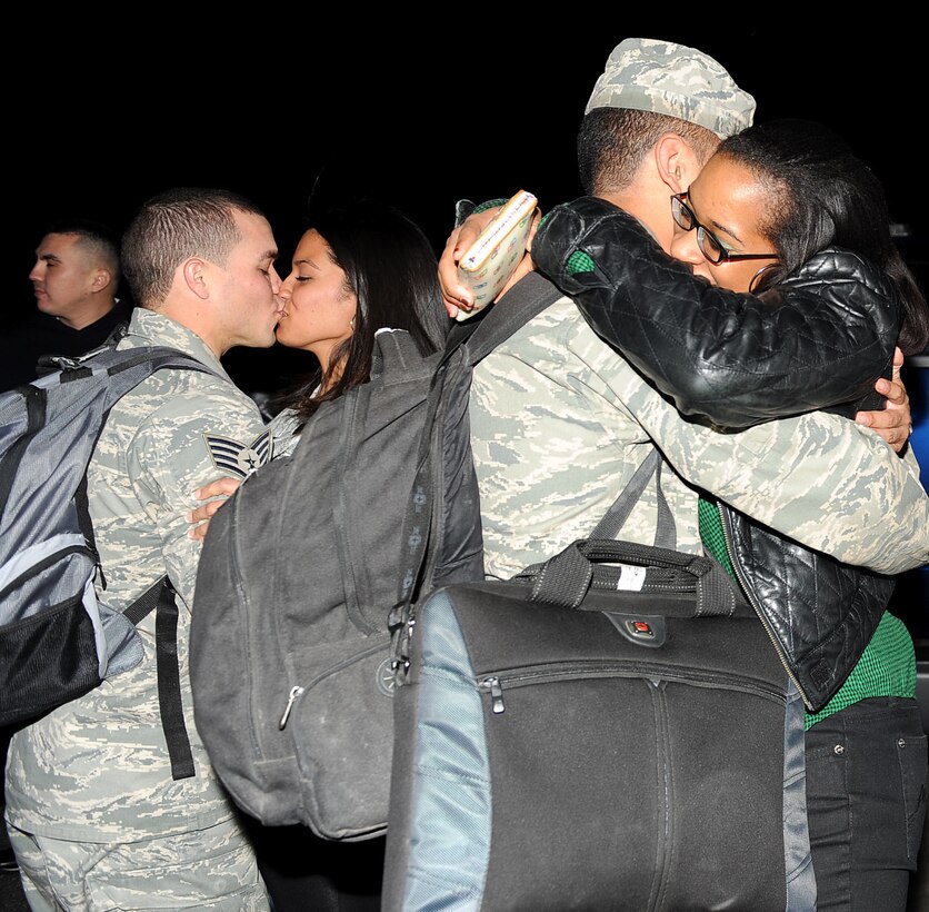 LANGLEY AIR FORCE BASE, Va. -- Families are reunited during the homecoming for eight 633d Logistics Readiness Squadron Airmen and one Air Combat Command A4 Airman March 5. The Airmen deployed for 200 days as Air Force Combat Convoy Vehicle Operators in support of the 586th Expeditionary Logistics Readiness Squadron at Camp Arifjan, Kuwait . (U.S. Air Force photo/Airman Rebecca Montez)