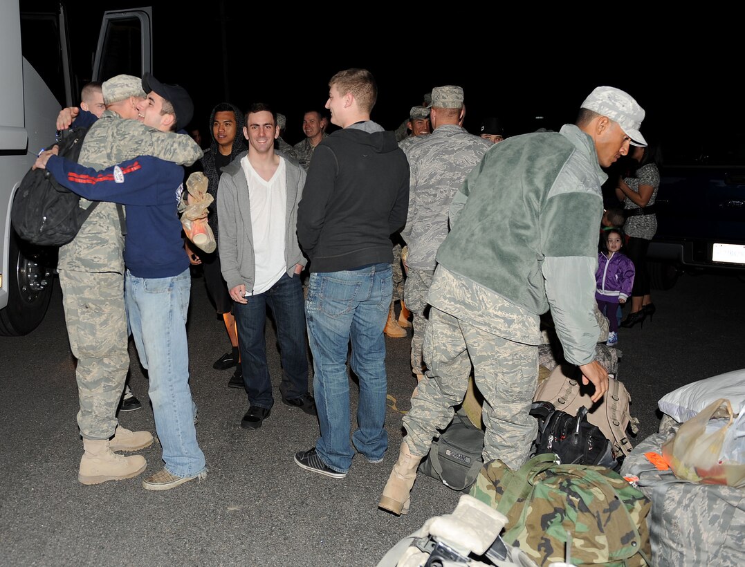 LANGLEY AIR FORCE BASE, Va. -- Families and friends greet eight 633d Logistics Readiness Squadron Airmen and one Air Combat Command A4 Airman March 5 upon their return from a 200-day deployment. The Airmen deployed as Air Force Combat Convoy Vehicle Operators in support of the 586th Expeditionary Logistics Readiness Squadron at Camp Arifjan, Kuwait . (U.S. Air Force photo/Airman Rebecca Montez)