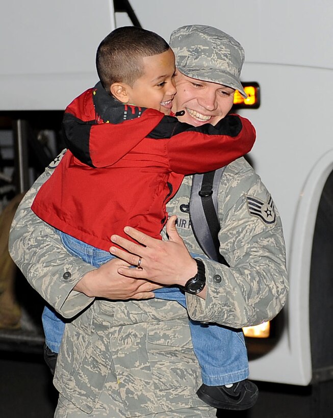 LANGLEY AIR FORCE BASE, Va. -- Staff Sgt. Michael Serrano, 633d Logistics Readiness Squadron vehicle operator, hugs his son, Rome, 5, during his homecoming March 5. Sergeant Serrano and eight others deployed for 200 days as Air Force Combat Convoy Vehicle Operators in support of the 586th Expeditionary Logistics Readiness Squadron at Camp Arifjan, Kuwait . (U.S. Air Force photo/Airman Rebecca Montez)