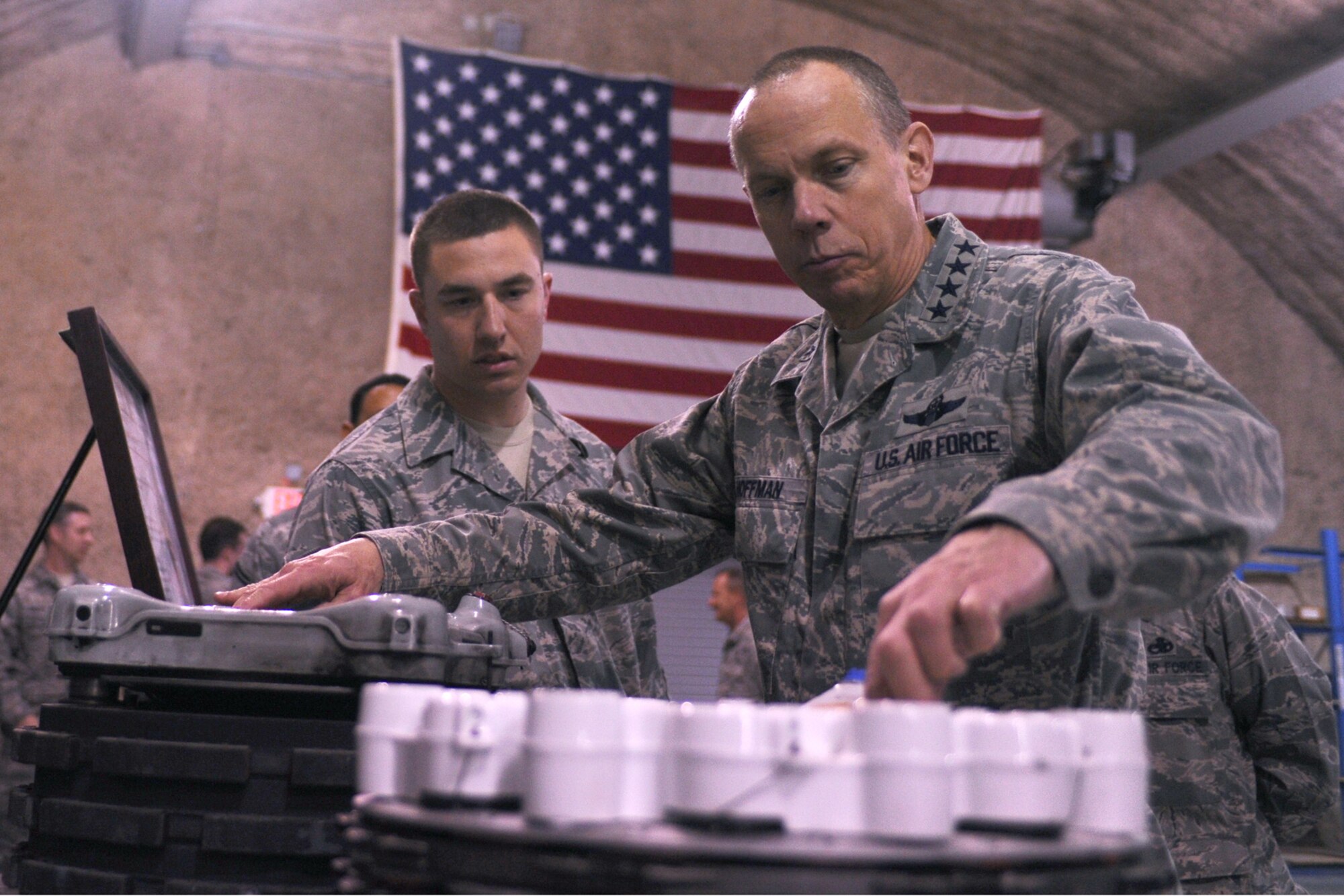 Gen. Donald Hoffman (right), Air Force Materiel Command
commander, examines two aircraft brakes while Senior Airman Stephen
Baumgart, 379th Expeditionary Maintenance Squadron, explains his mission at
a location in Southwest Asia last month. General Hoffman, along with other
AFMC senior leaders, visited as part of a trip through the U.S. Central
Command's area of responsibility to acquire feedback directly from the
warfighter about the test and sustainment support the command is
contributing to the fight. (U.S. Air Force photo/Senior Airman Kasey
Zickmund)