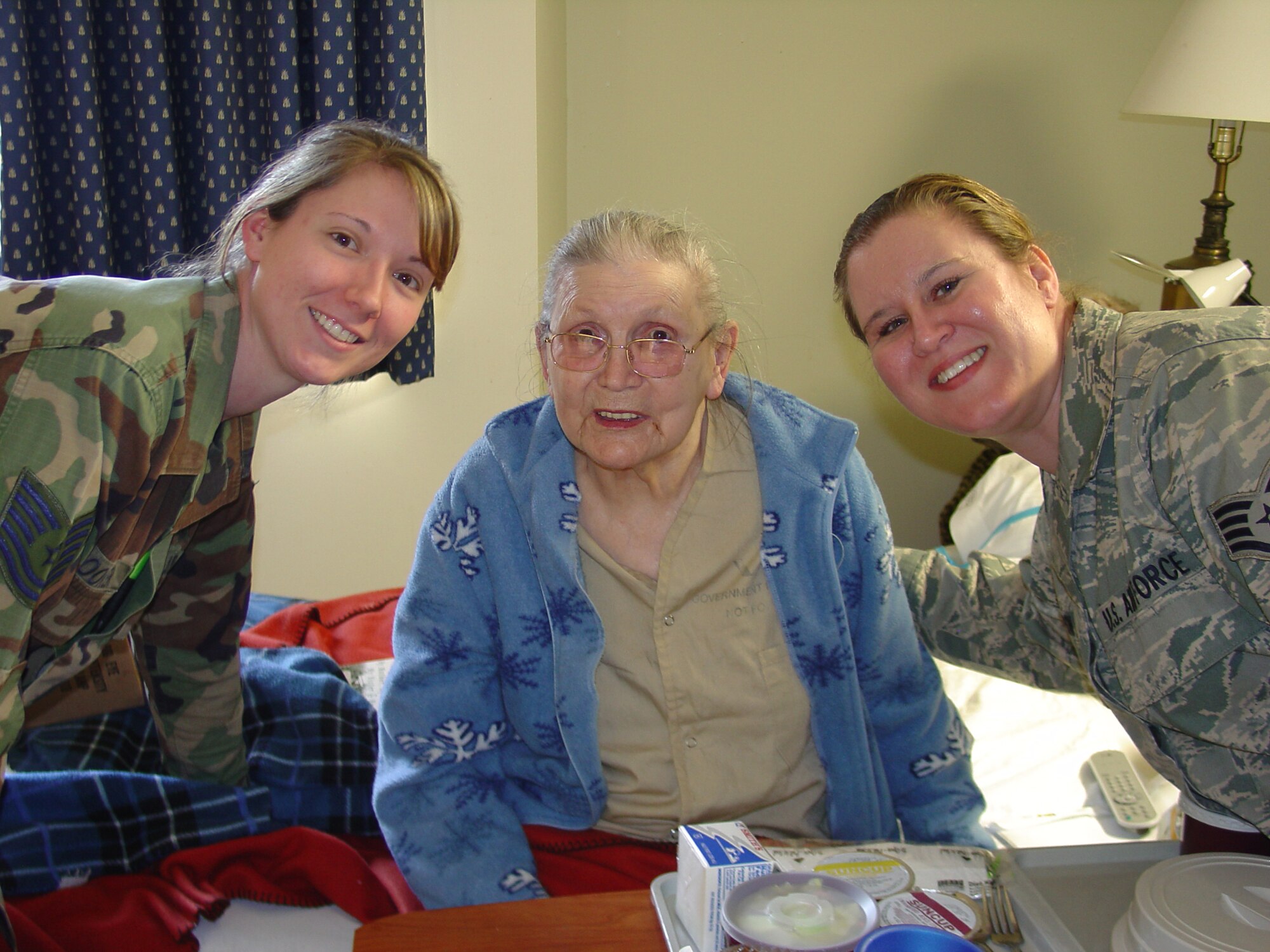 WRIGHT-PATTERSON AIR FORCE BASE, Ohio – On the left; Tech. Sgt. Charran Booker and Staff Sgt. Jannette Johnson, both from the 445th Aeromedical Staging Squadron, visit with Ms. Wanda Frost at the Veterans Affairs Medical Center, Dayton, Ohio, during the Mar. 6. unit training assembly. The 445th Airlift Wing Chief’s Group assembled a group of volunteers from the wing to meet with the veterans. (U.S. Air Force photo/Unit Public Affairs Representative Maj. Mary Reed) 