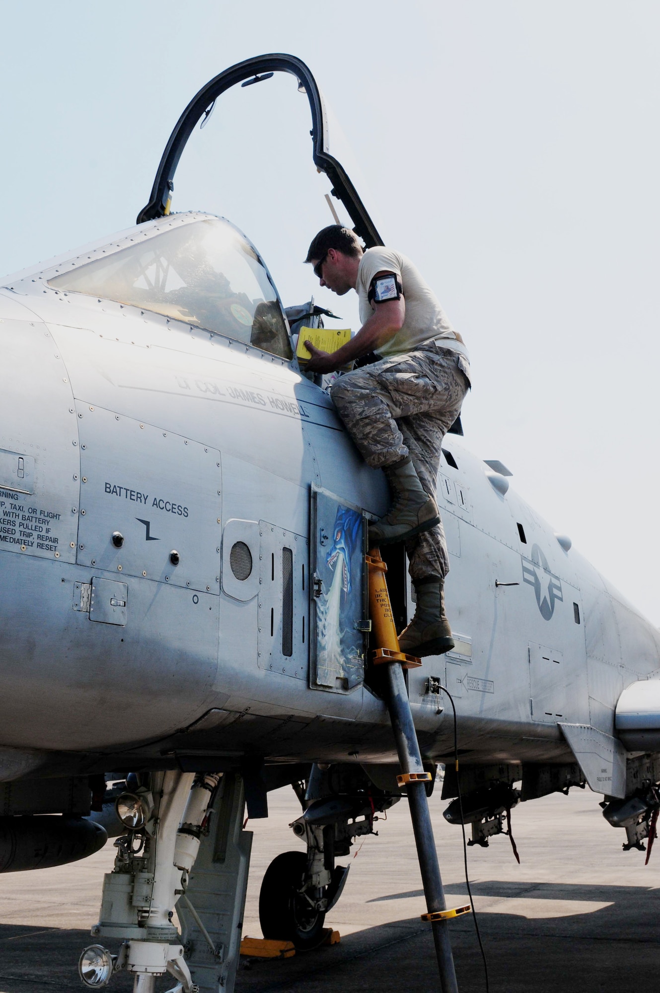 Senior Airman Graeme Clark prepares the cockpit of an A-10 Thunderbolt II March 4, 2010, for pilots participating in Cope Tiger 2010 at Udon Thani Royal Thai Air Force Base, Thailand. Airman Clark is deployed to the exercise from Osan Air Base, South Korea. (U.S. Air Force photo/Capt. Genieve David)