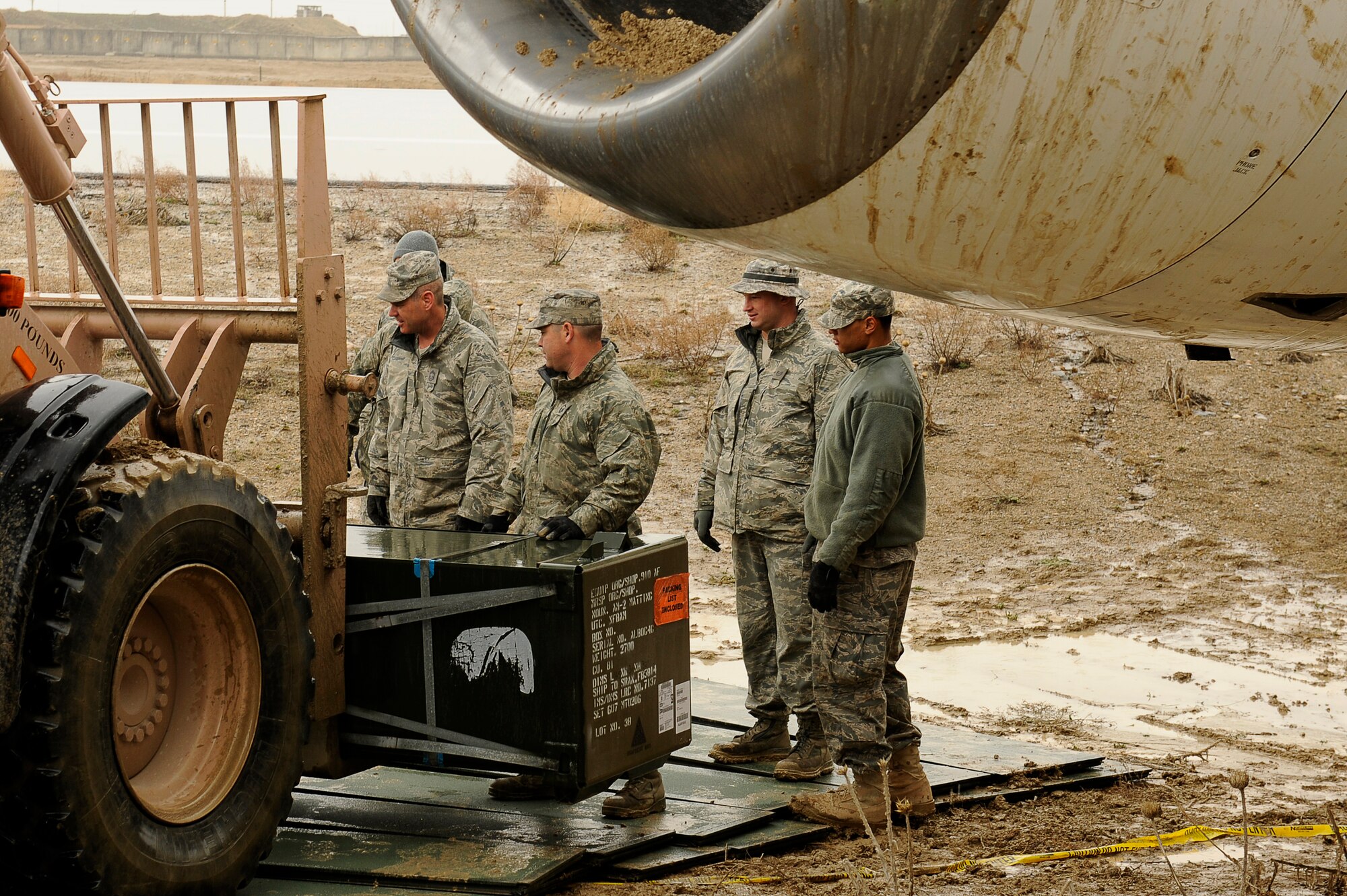 Airmen lay down matting so they can move an Airbus A300 after its crew preformed an emergency landing March 3, 2010,at Bagram Airfield. (U.S. Air Force photo by/Tech. Sgt. Jeromy K. Cross)